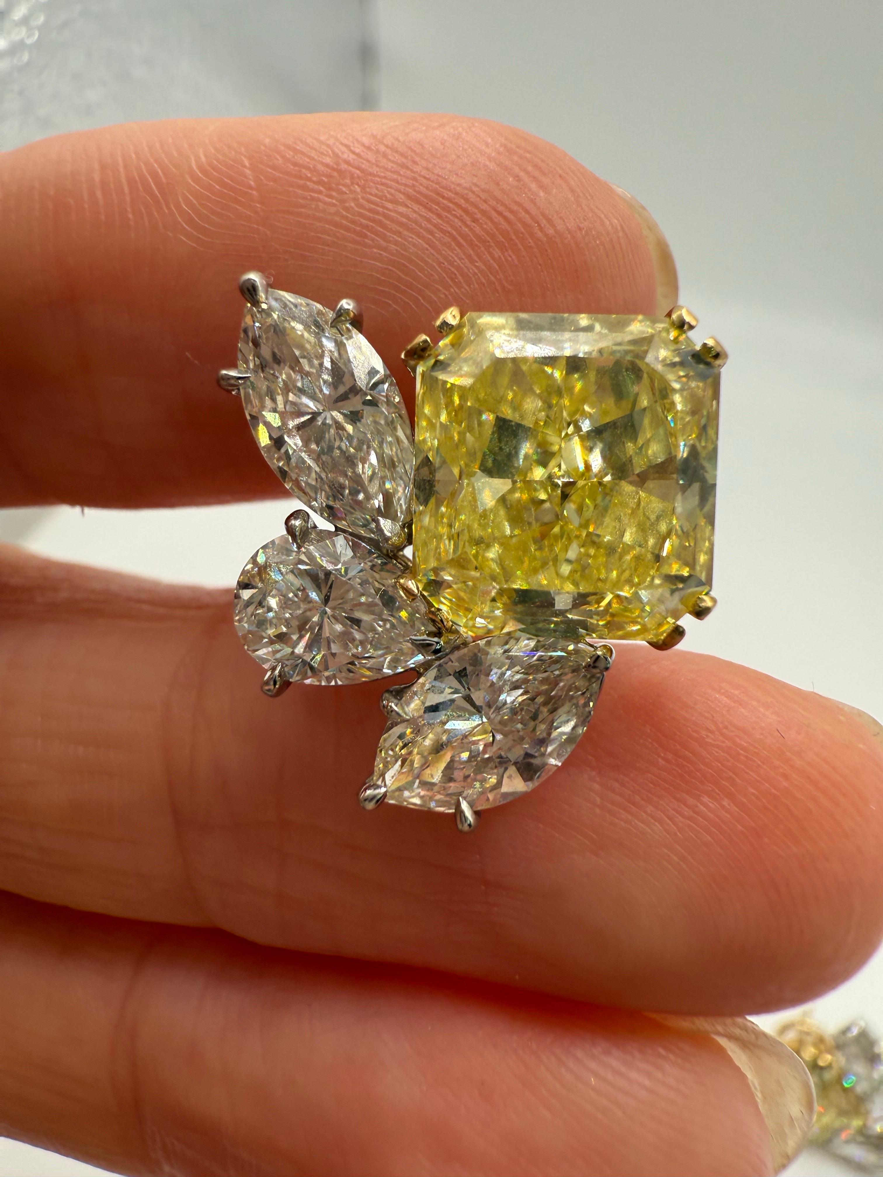 A rare find on these matching fancy intense yellow diamond studs 6.01 carats is Fancy Intense Yellow VVS2 and 6.01 radiant is fancy intense yellow VS1 both GIA certified, please inquire and i will send you GIA certificates. Design is modern made to