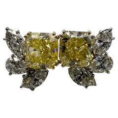 GIA certified Fancy Intense Yellow Diamond earrings VVS 12.18 carats