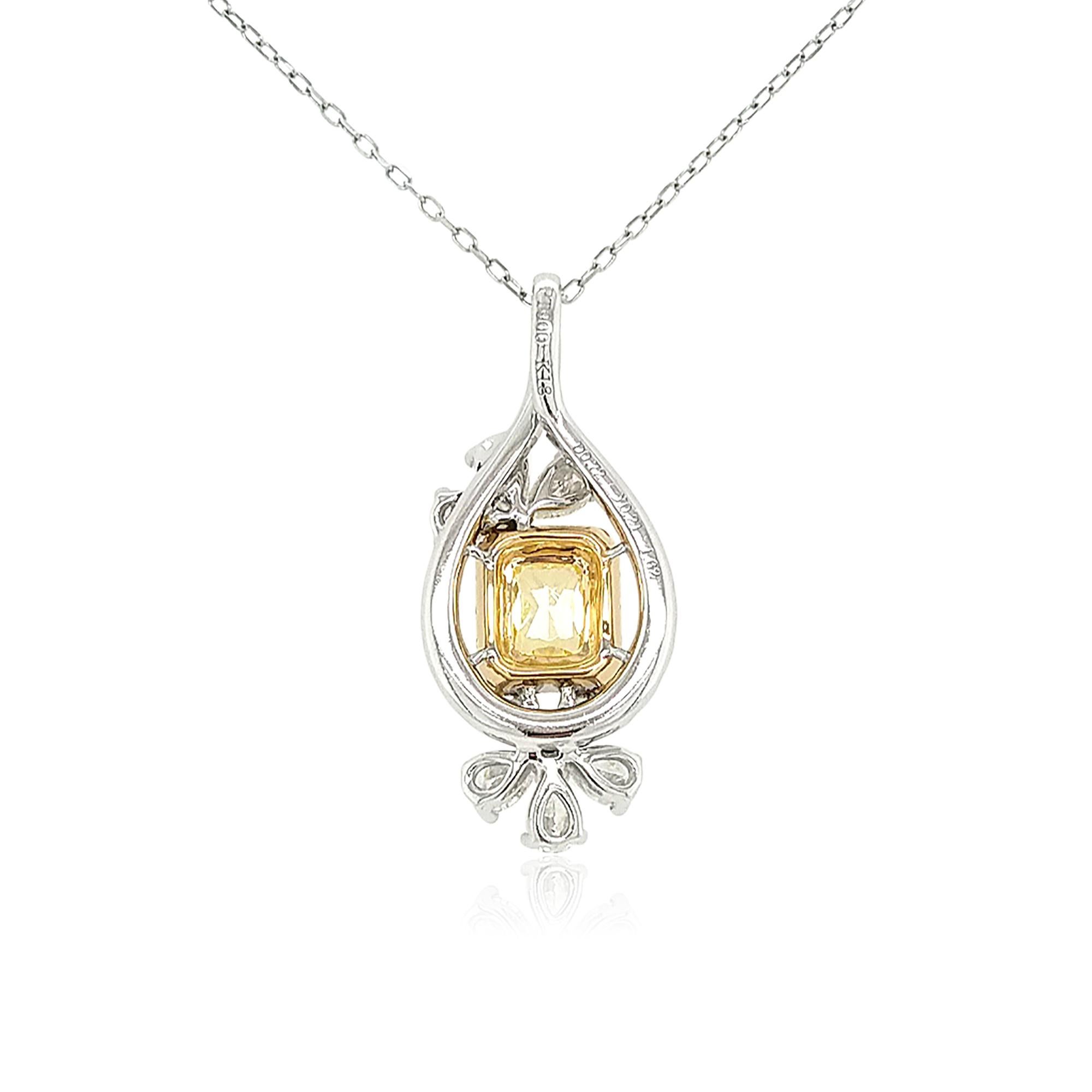 This unique pendant design features a lustrous Fancy Intense Yellow Diamond at its centre, set amongst a contemporary design of small Yellow and White Diamonds. Set in Platinum to enrich the sparkle of the diamonds and the lustre of the Yellow