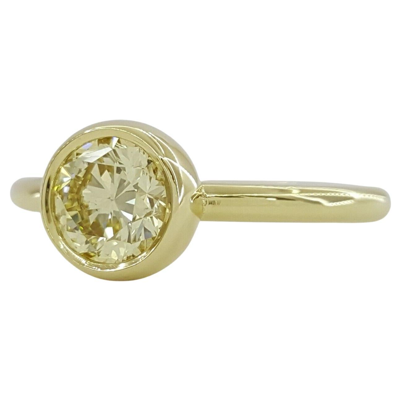 Modern GIA Certified Fancy Light Yellow 18 Carat Yellow Gold Diamond Ring For Sale