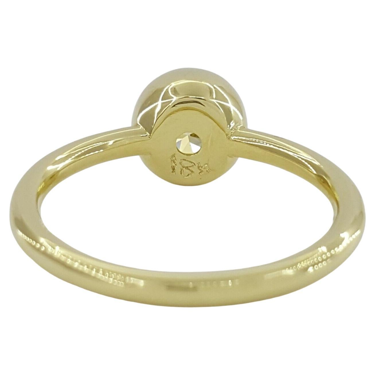 Emerald Cut GIA Certified Fancy Light Yellow 18 Carat Yellow Gold Diamond Ring For Sale
