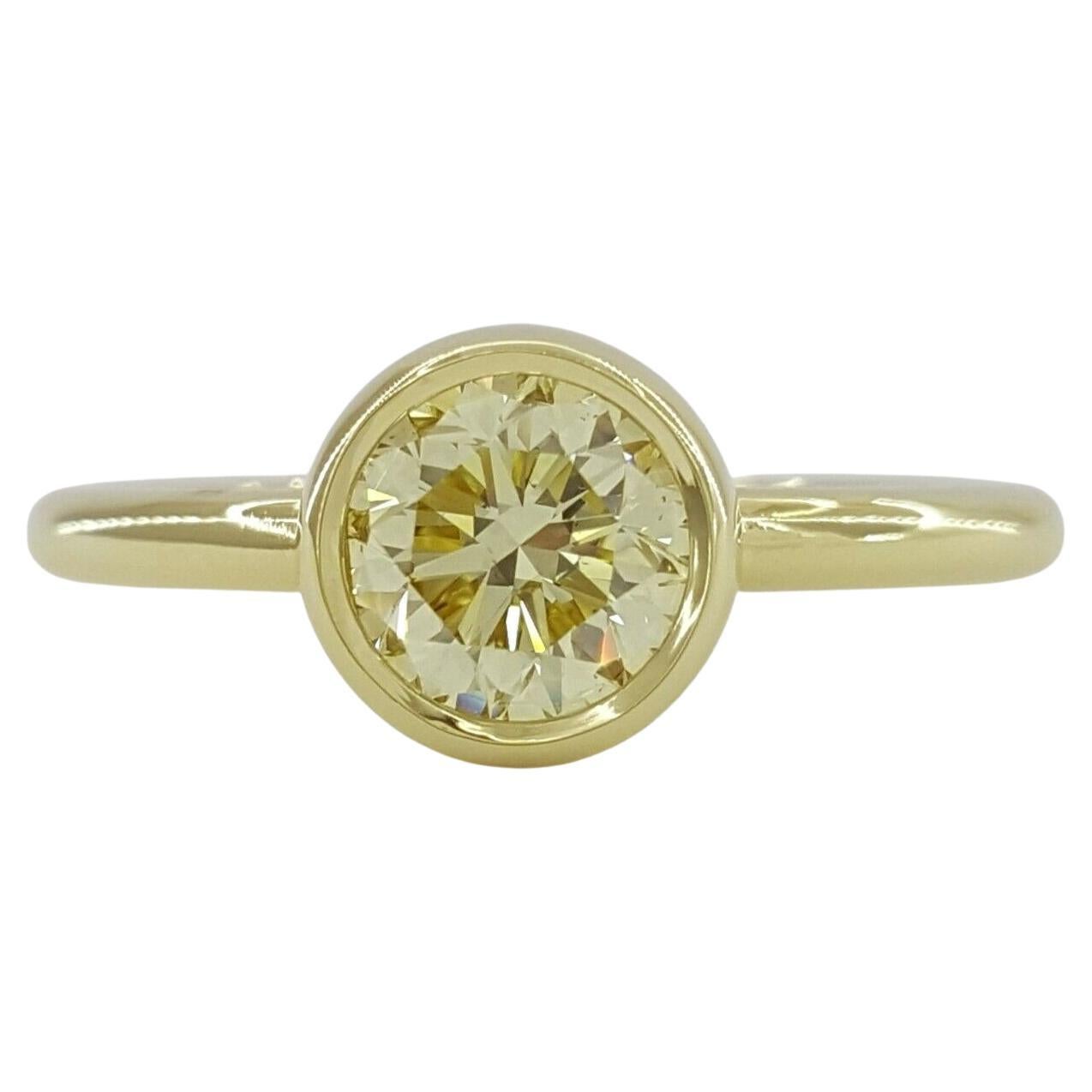 GIA Certified Fancy Light Yellow 18 Carat Yellow Gold Diamond Ring For Sale