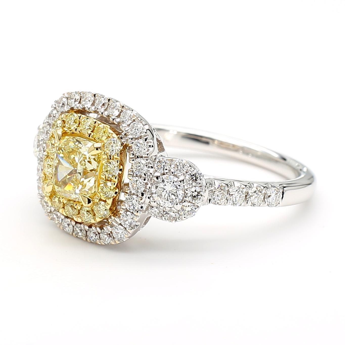 RareGemWorld's beautiful GIA certified diamond ring. Mounted in a beautiful 18K Yellow and White Gold setting with a natural cushion cut yellow diamond. The yellow diamond is surrounded by round natural yellow diamond melee and round natural white