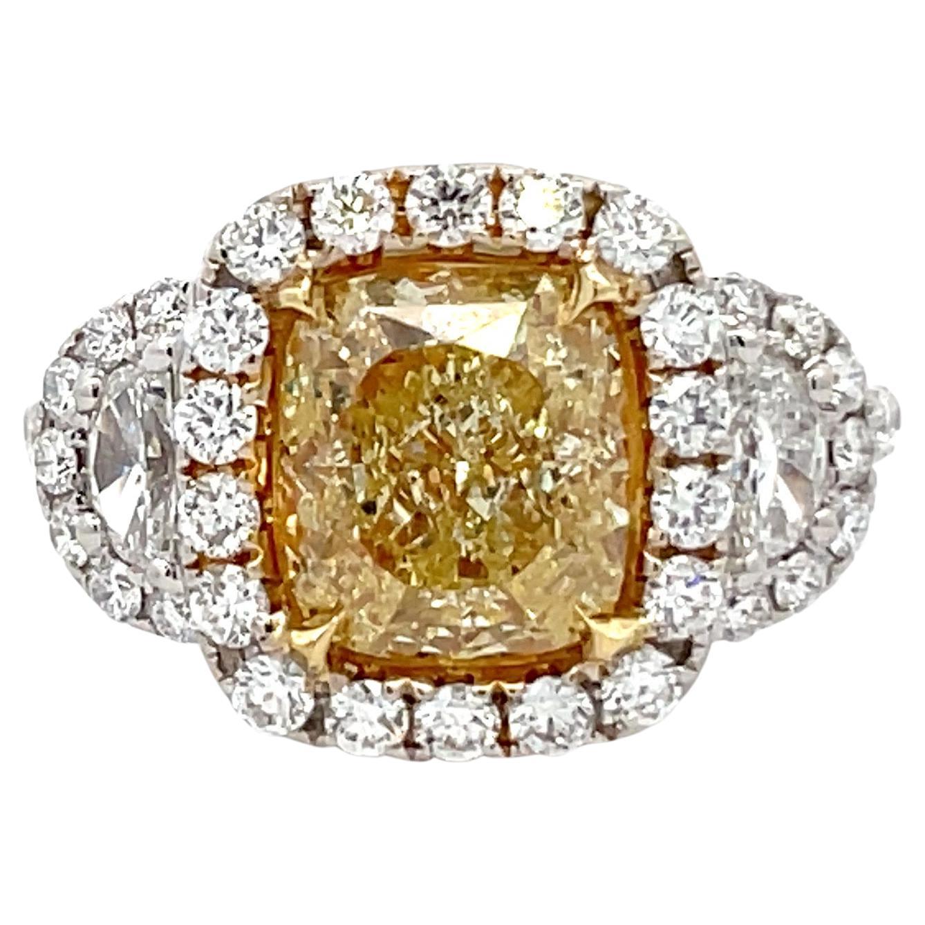 GIA Certified Fancy Light Yellow Cushion Three Stone Halo Ring 3.93 Carats 18K For Sale