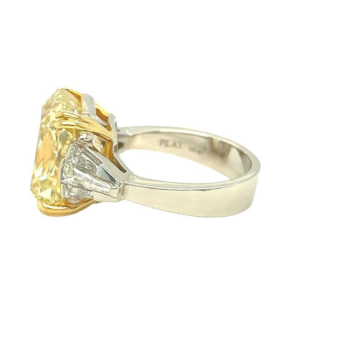 Discover the epitome of timeless elegance with this extraordinary GIA-certified 11.69-carat Fancy Light Yellow Diamond, elegantly cut in an antique cushion shape. The center stone radiates vivid yellow brilliance and is secured with double prongs in