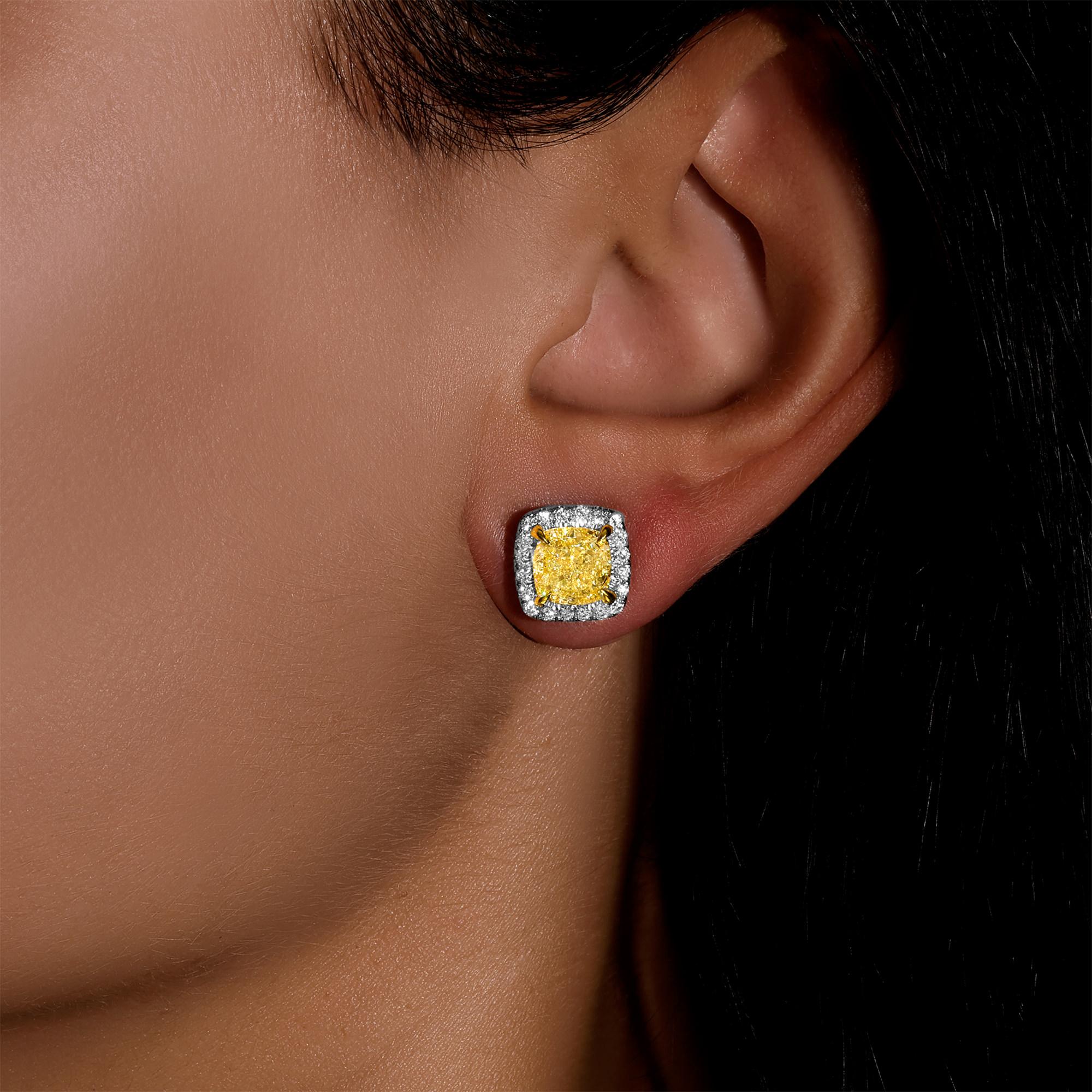 It comes with the GIA Certificate
All Gemstones are Natural
2 Fancy Light Yellow Diamonds = 4.34 Carats
Cut: Cushion; Clarity: VVS2
40 White Diamonds =  0.47 Carats
Metal: 18K White and Yellow Gold