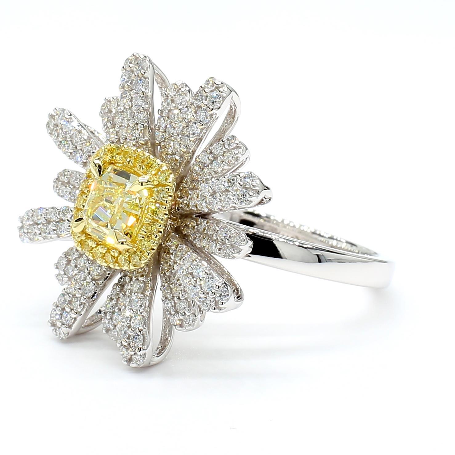RareGemWorld's beautiful GIA certified diamond ring. Mounted in a beautiful 18K Yellow and White Gold setting with a natural radiant cut yellow diamond. The yellow diamond is surrounded by round natural yellow diamond melee and round natural white
