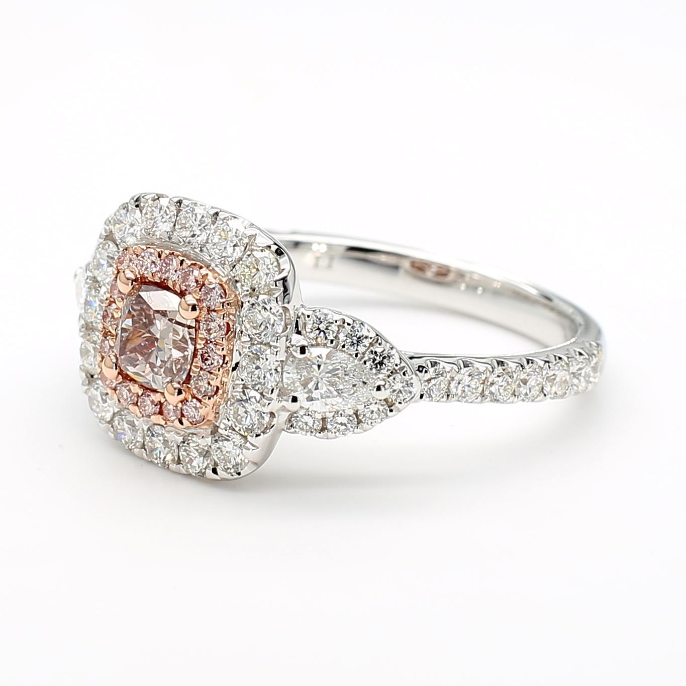 RareGemWorld's beautiful GIA certified diamond ring. Mounted in a beautiful 18K Rose and White Gold setting with a natural cushion cut pink diamond. The diamond is surrounded by round natural pear cut white diamonds, natural pink diamond melee, and