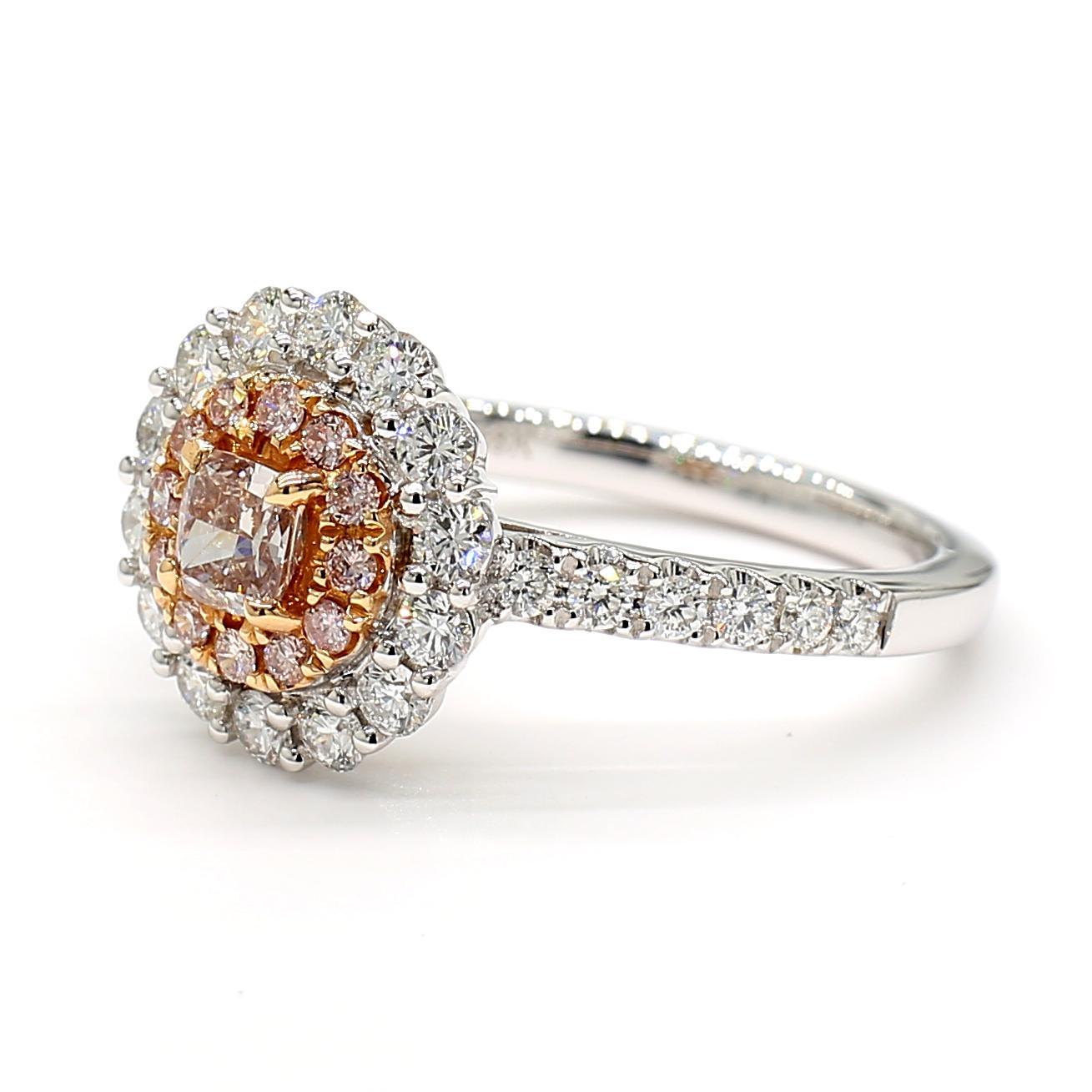 RareGemWorld's beautiful GIA certified diamond ring. Mounted in a beautiful platinum setting with a natural cushion cut pink diamond. The diamond is surrounded by round natural pink diamond melee and round natural white diamond melee. This ring is