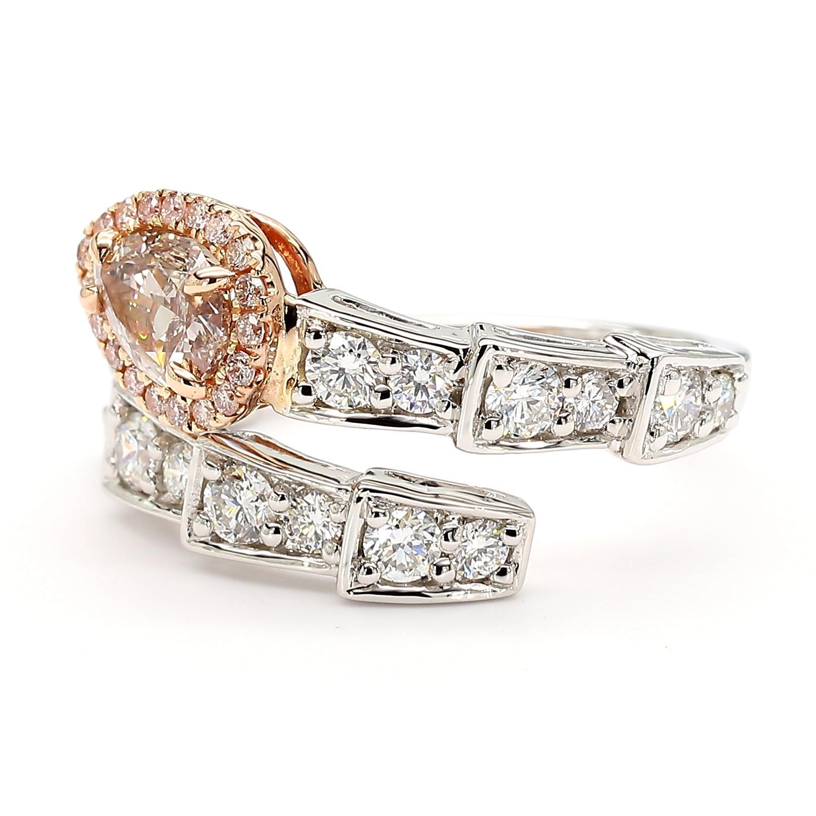 RareGemWorld's beautiful GIA certified diamond ring. Mounted in a beautiful 18K Rose and White Gold setting with a natural pear cut pink diamond. This diamond is surrounded by round natural pink diamond melee and round natural white diamond melee.