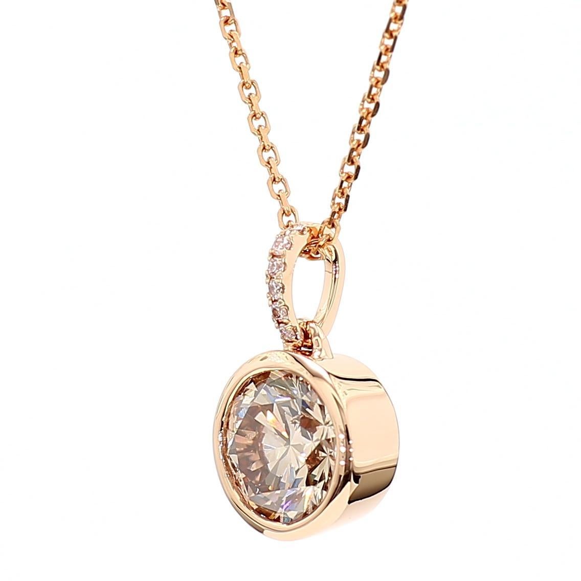 RareGemWorld's beautiful GIA certified diamond pendant. Mounted in a beautiful 18K Rose Gold setting with a natural round pink diamond complimented by natural round pink diamond melee. This pendant is guaranteed to impress and enhance your personal