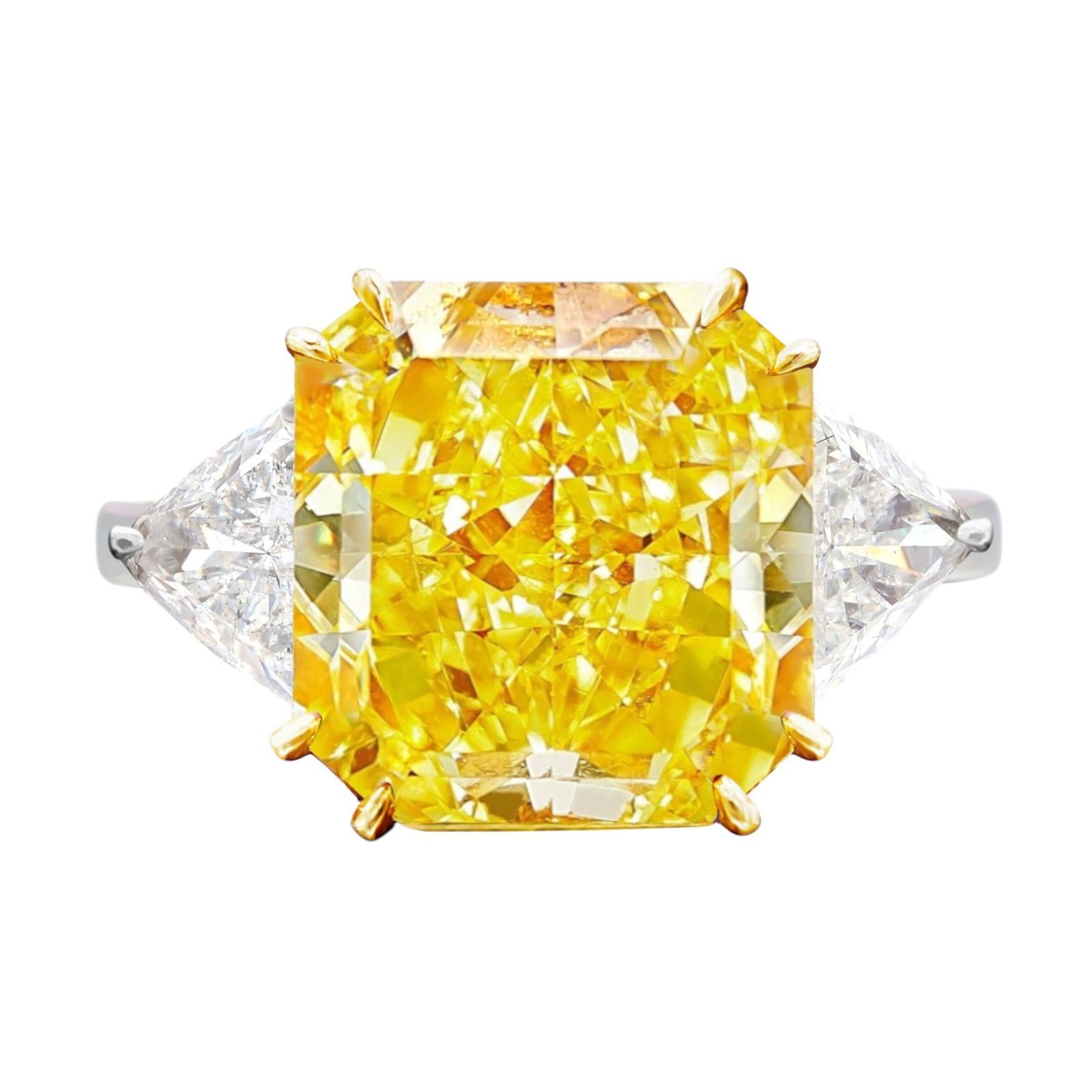 An exquisite  4 carat Radiant Brilliant Cut Natural Yellow Diamond Three Stone Engagement Ring in Platinum & 18K Yellow Gold. 



The center stone is a 4ct Natural Radiant Brilliant Cut diamond, Fancy VIVID color of the center diamond is an