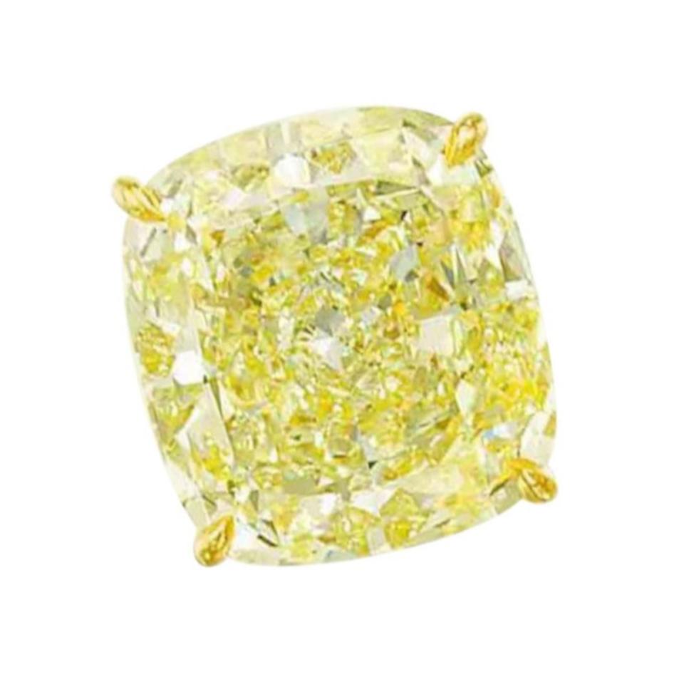 GIA Certified Fancy Yellow 4 Carat Cushion Cut Diamond Studs In New Condition For Sale In Chicago, IL