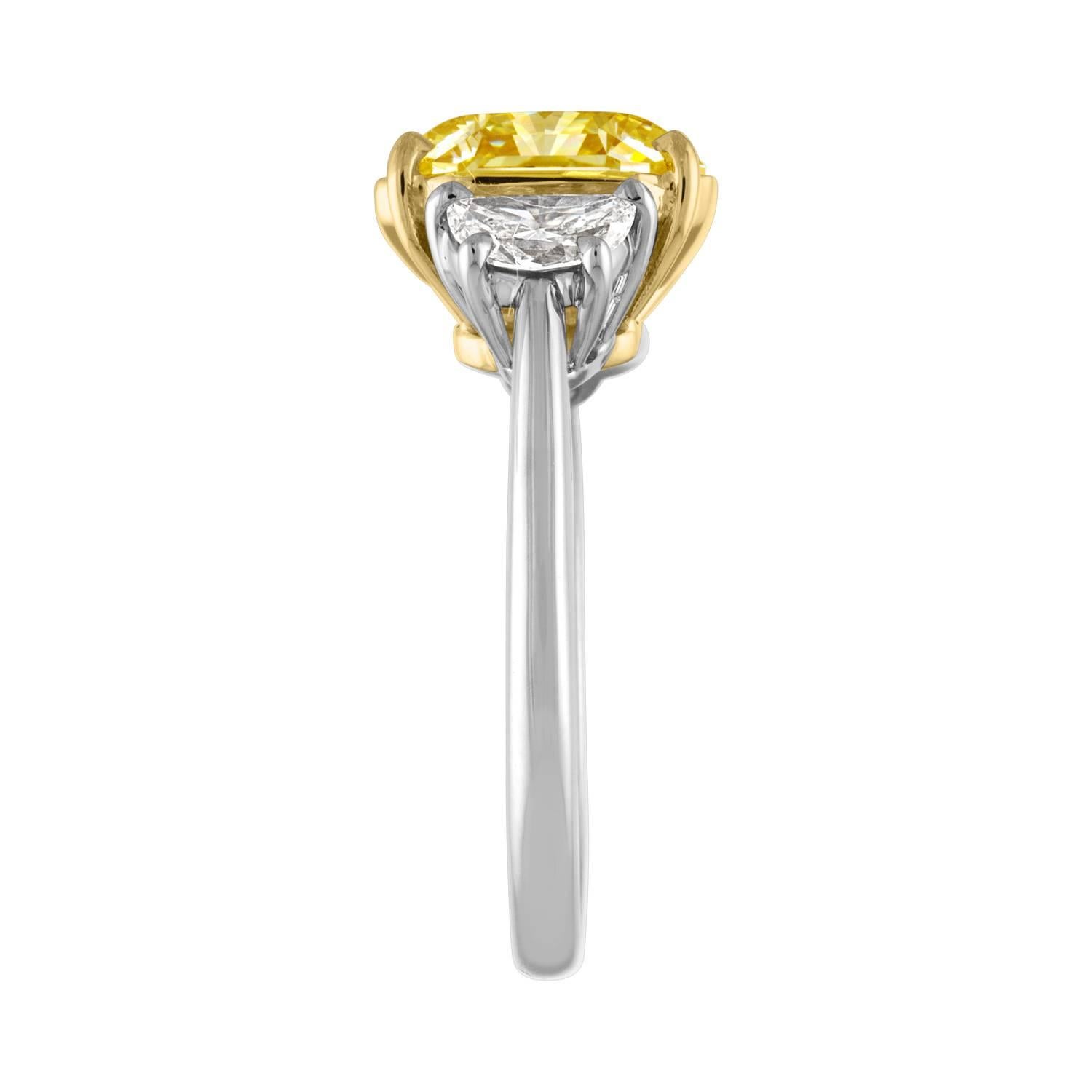 Contemporary GIA Certified Fancy Yellow 4.09 Carat Cushion Cut Diamond Three-Stone Ring