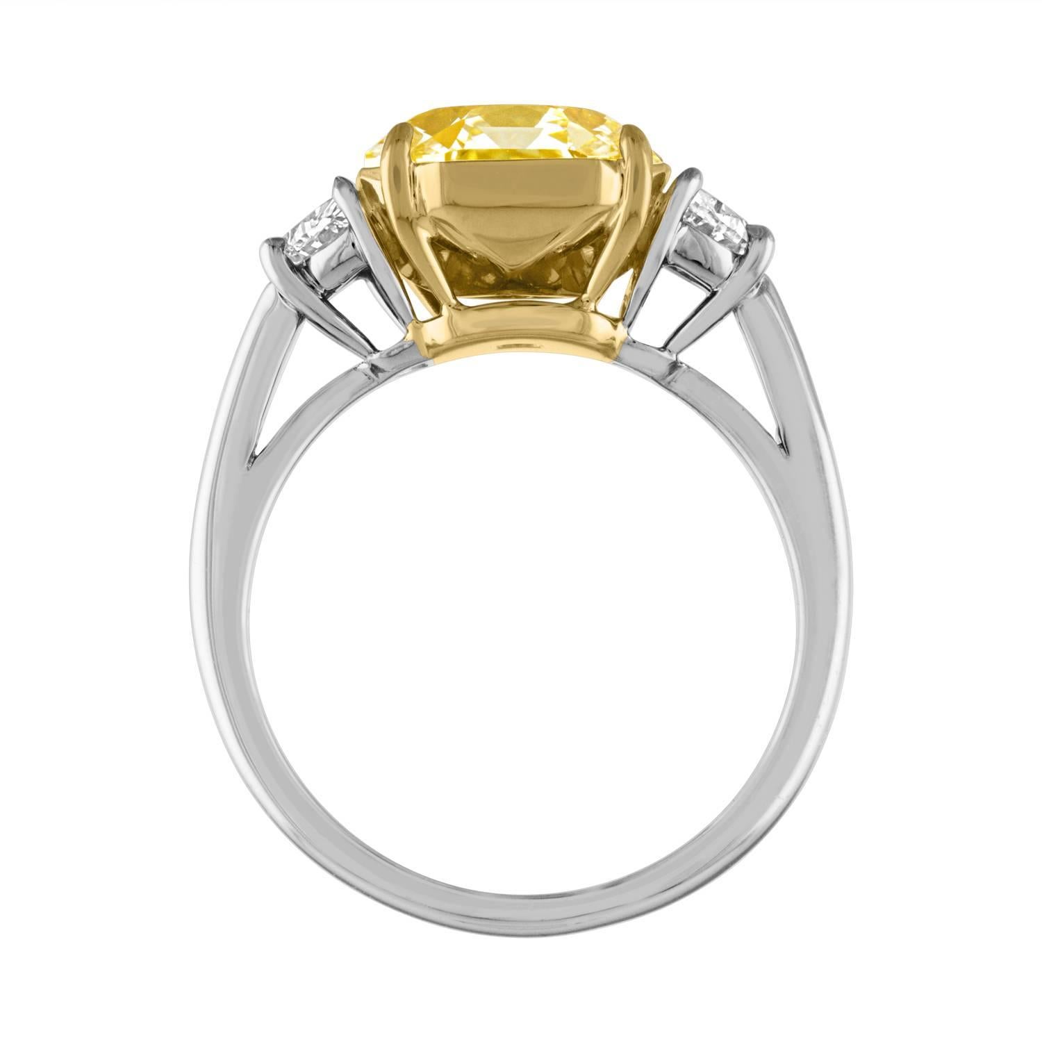 Women's GIA Certified Fancy Yellow 4.09 Carat Cushion Cut Diamond Three-Stone Ring