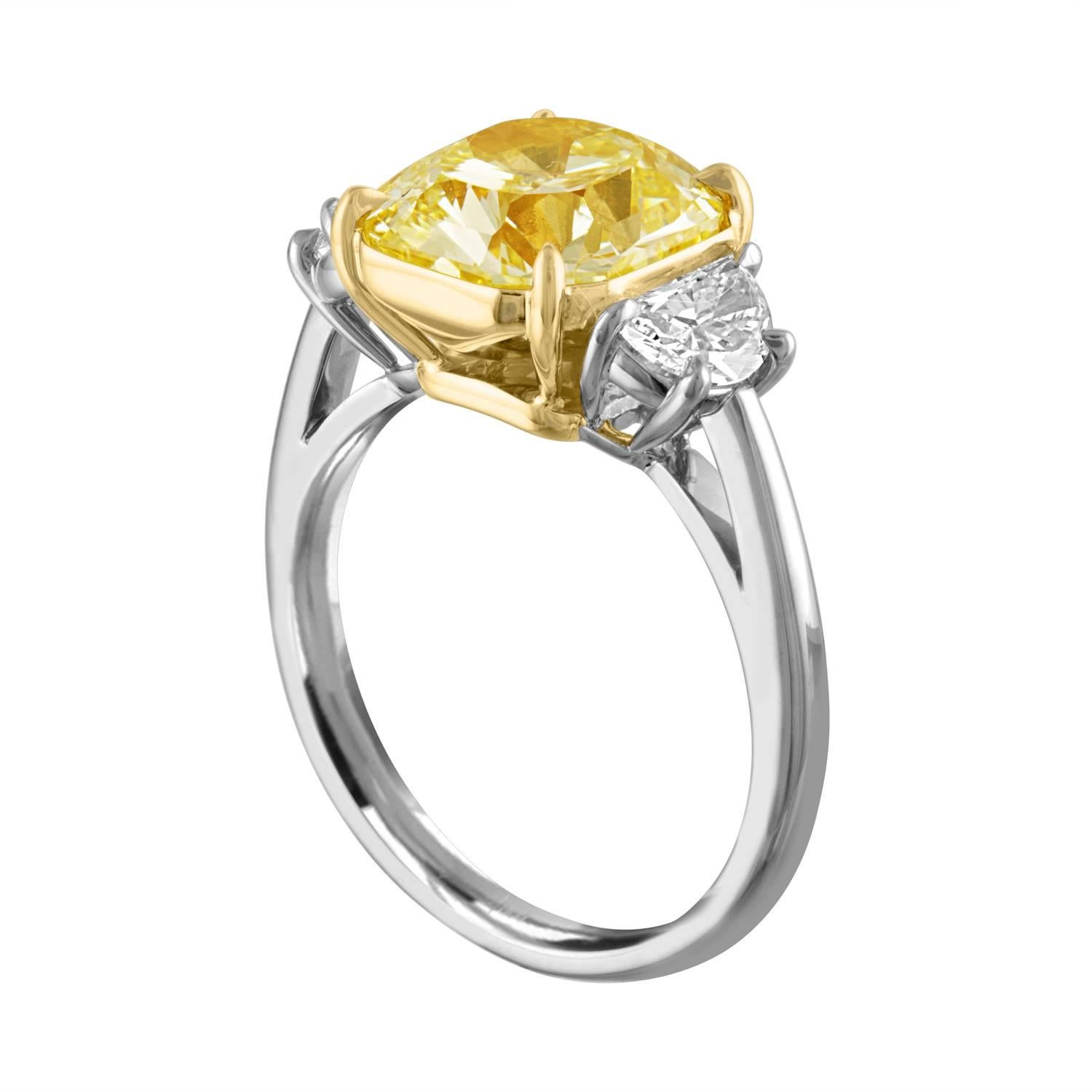 GIA Certified Fancy Yellow 4.09 Carat Cushion Cut Diamond Three-Stone Ring 1