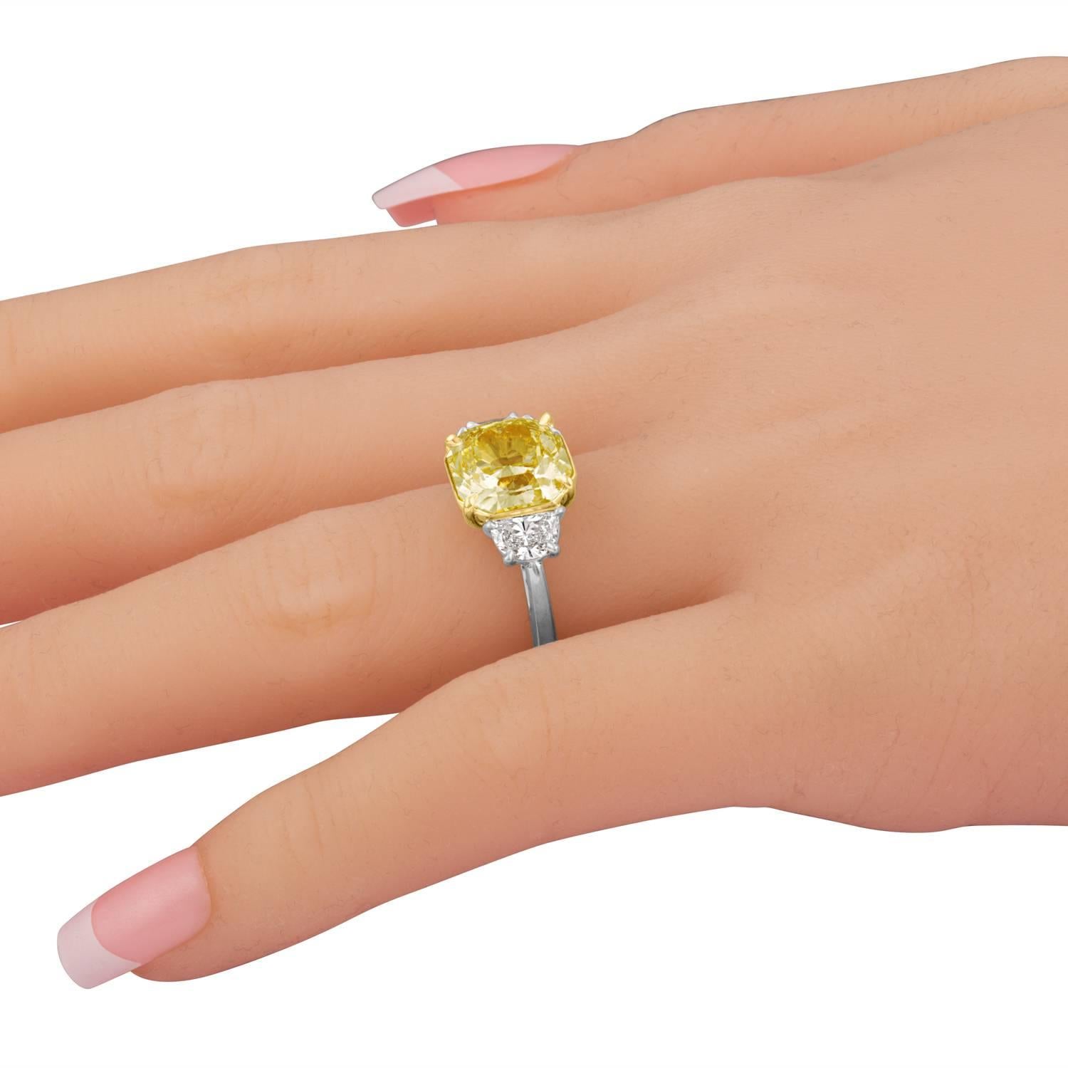 GIA Certified Fancy Yellow 4.09 Carat Cushion Cut Diamond Three-Stone Ring 2