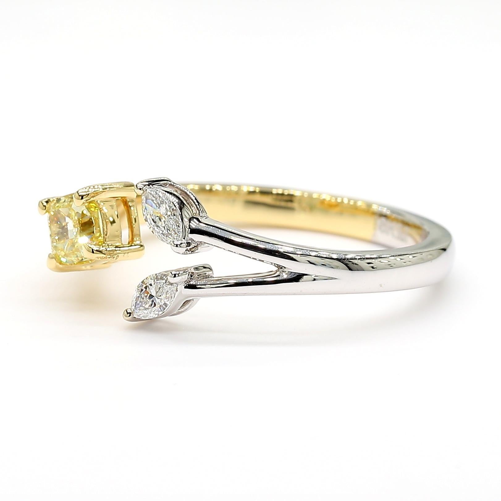 RareGemWorld's beautiful GIA certiifed diamond ring. Mounted in a beautiful 18K Yellow and White Gold setting with a natural cushion cut yellow diamond. The yellow diamond is surrounded by natural marquise cut white diamonds. This ring is guaranteed