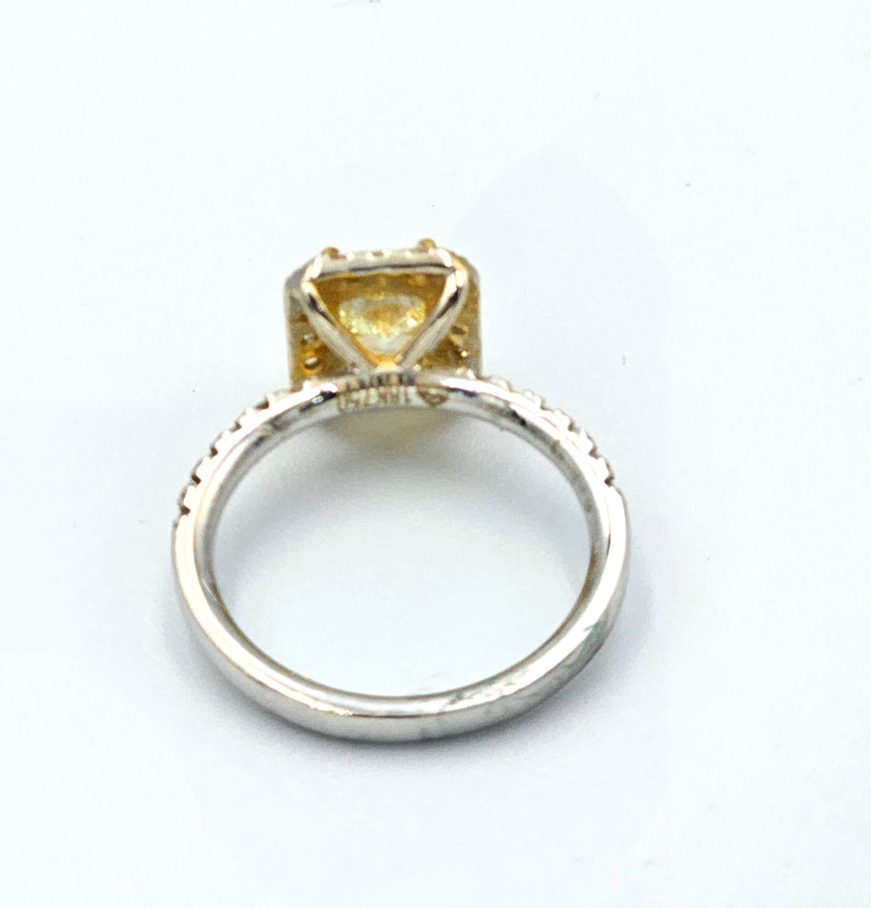 This is a beautiful GIA certified Fancy Yellow Diamond Ring with diamonds and 18k gold. It is a beautiful and amazing piece with vivid color, set in a custom designed ring to enhance its natural beauty!
Fancy Yellow Diamond : 1.09