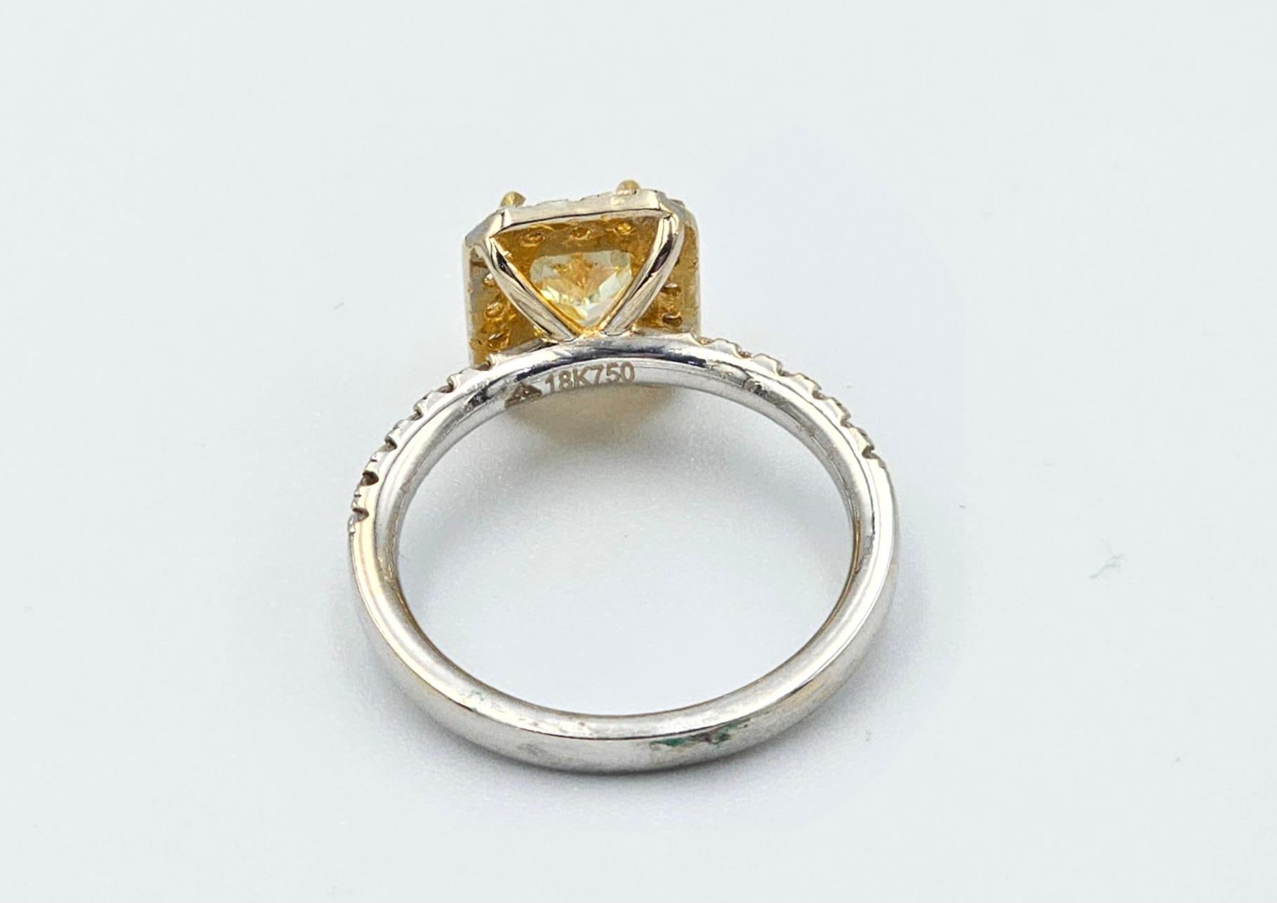 This is a beautiful GIA certified Fancy Yellow Diamond Ring with diamonds and 18k gold. It is a beautiful and amazing piece with vivid color, set in a custom designed ring to enhance its natural beauty!
Fancy Yellow Diamond : 1.14