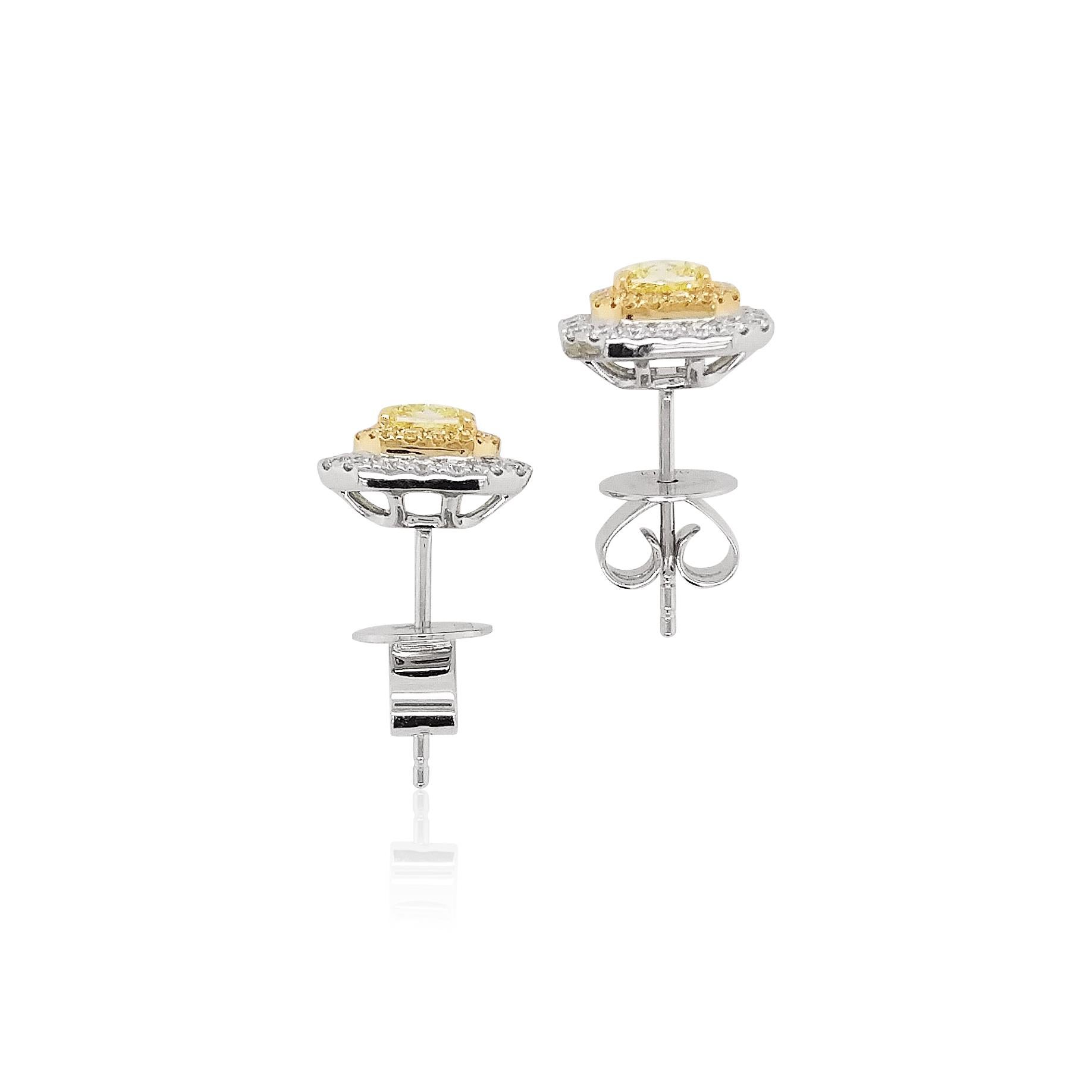 These magnificent 18 Karat gold stud earrings are featured by GIA certified natural Fancy Yellow Diamonds and White Diamonds. Each diamond has been selected for their superior lustre and striking color, and they are easy to transition from day to