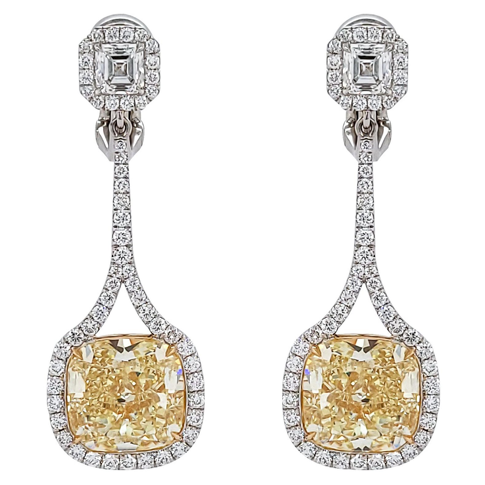 Stunning drop earrings featuring two cushion fancy yellow diamonds, two ascher cut diamonds surrounded by pave diamonds. 
Fancy yellow diamonds are certified by GIA. The weight is 6.50 and 6.14 carats, clarity is VS2.
Ascher cut diamonds are 0.50