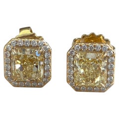 GIA Certified Fancy Yellow Diamond Earrings DTW. 4.77 Carat