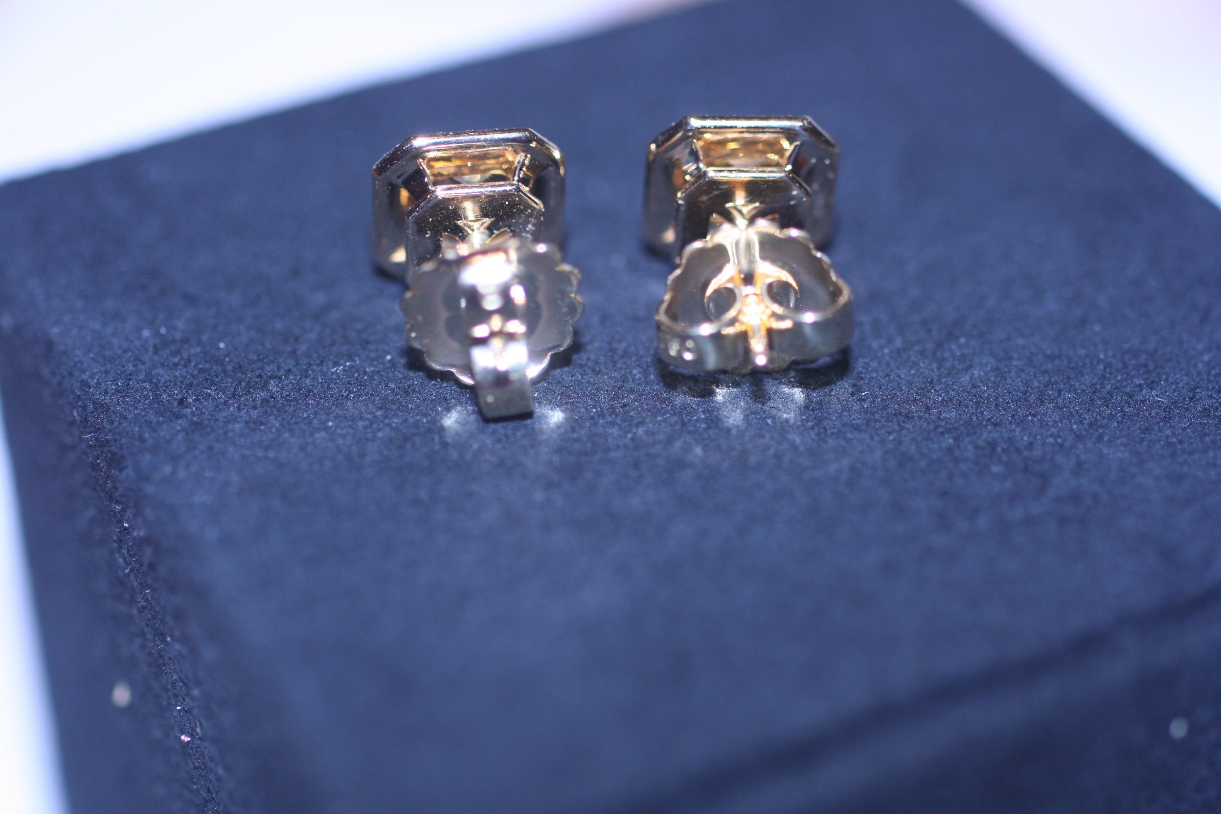 Radiant Cut GIA Certified Fancy Yellow Diamond Earrings DTW. 4.77 Carat