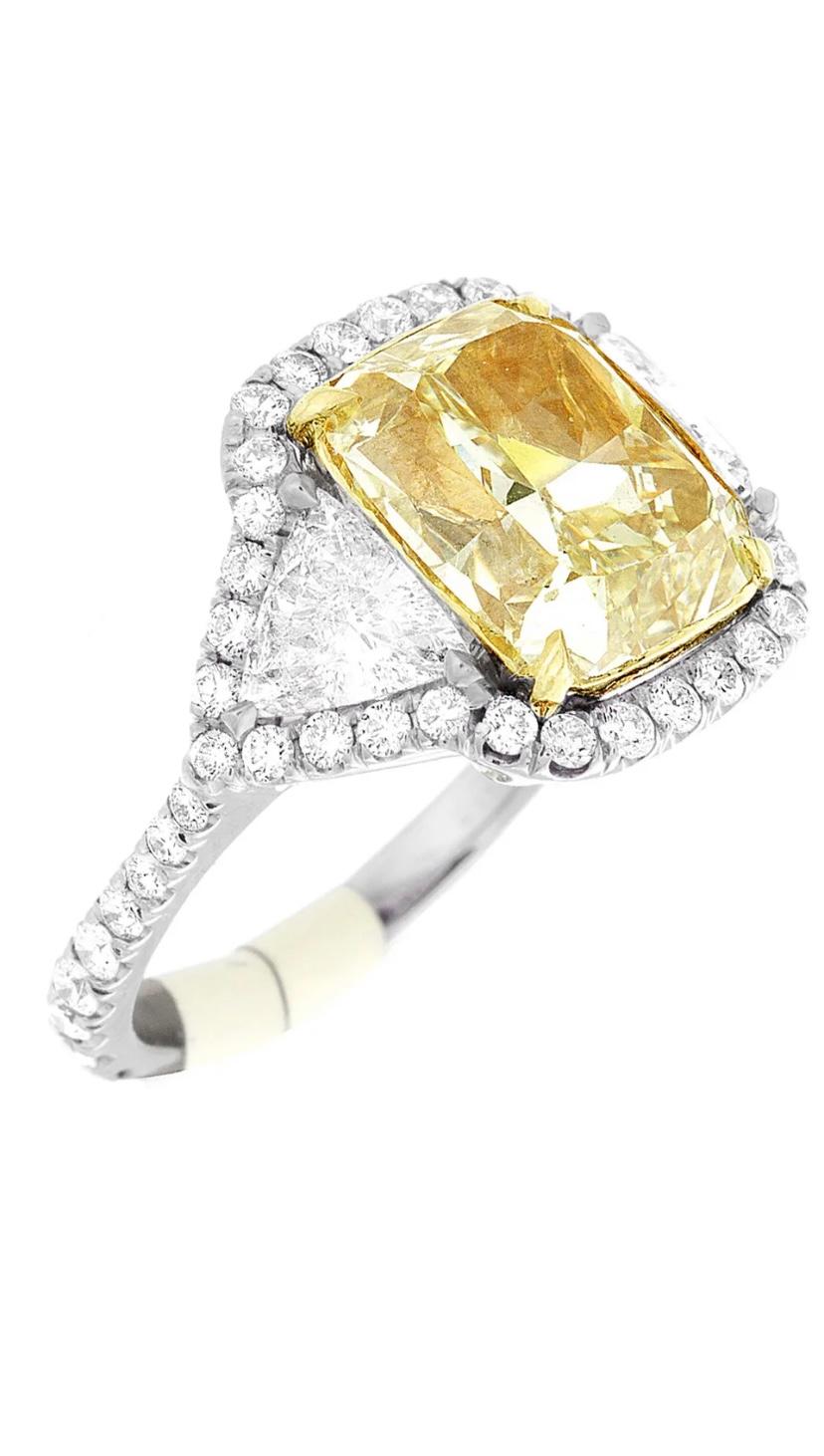 Cushion Cut GIA Certified Fancy Yellow Diamond of 5.01 Carats Ring VVS2 For Sale