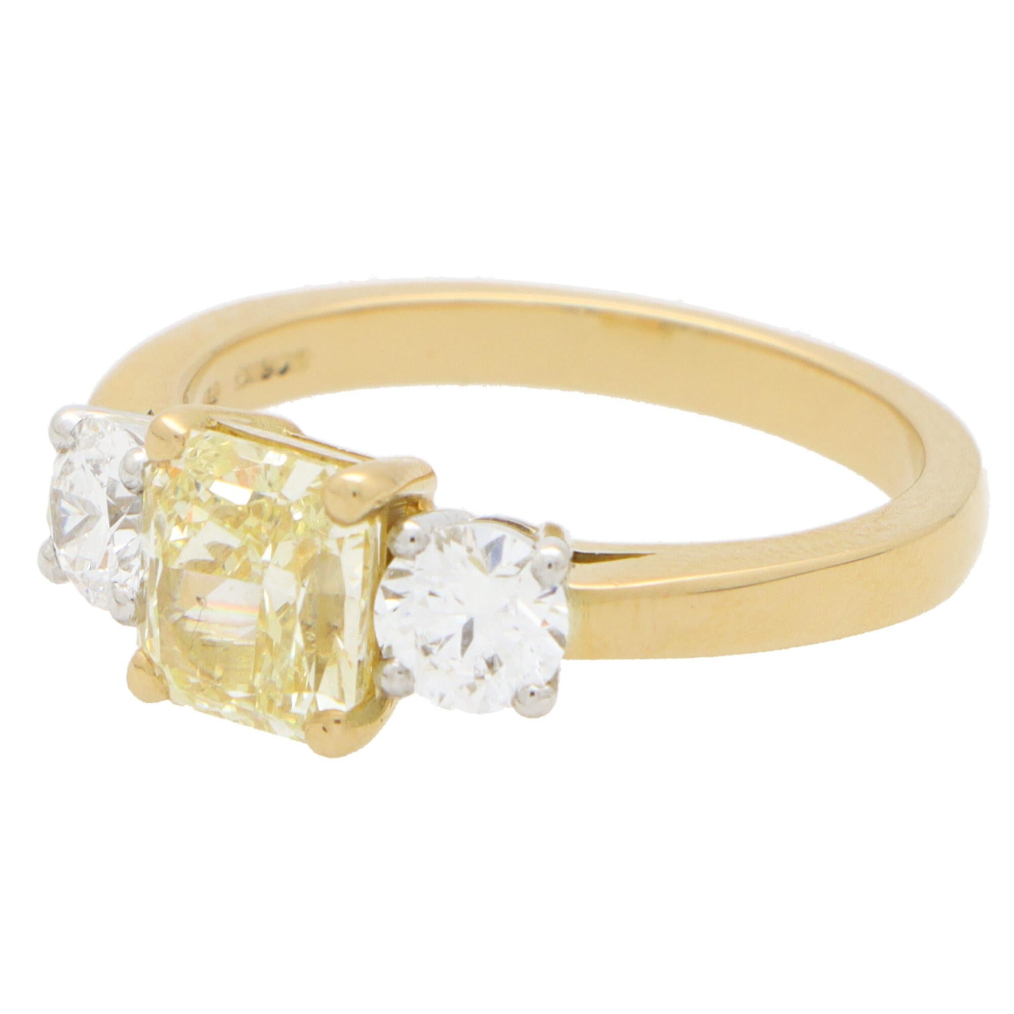 Modern GIA Certified Fancy Yellow Diamond Three Stone Engagement Ring in 18k Gold