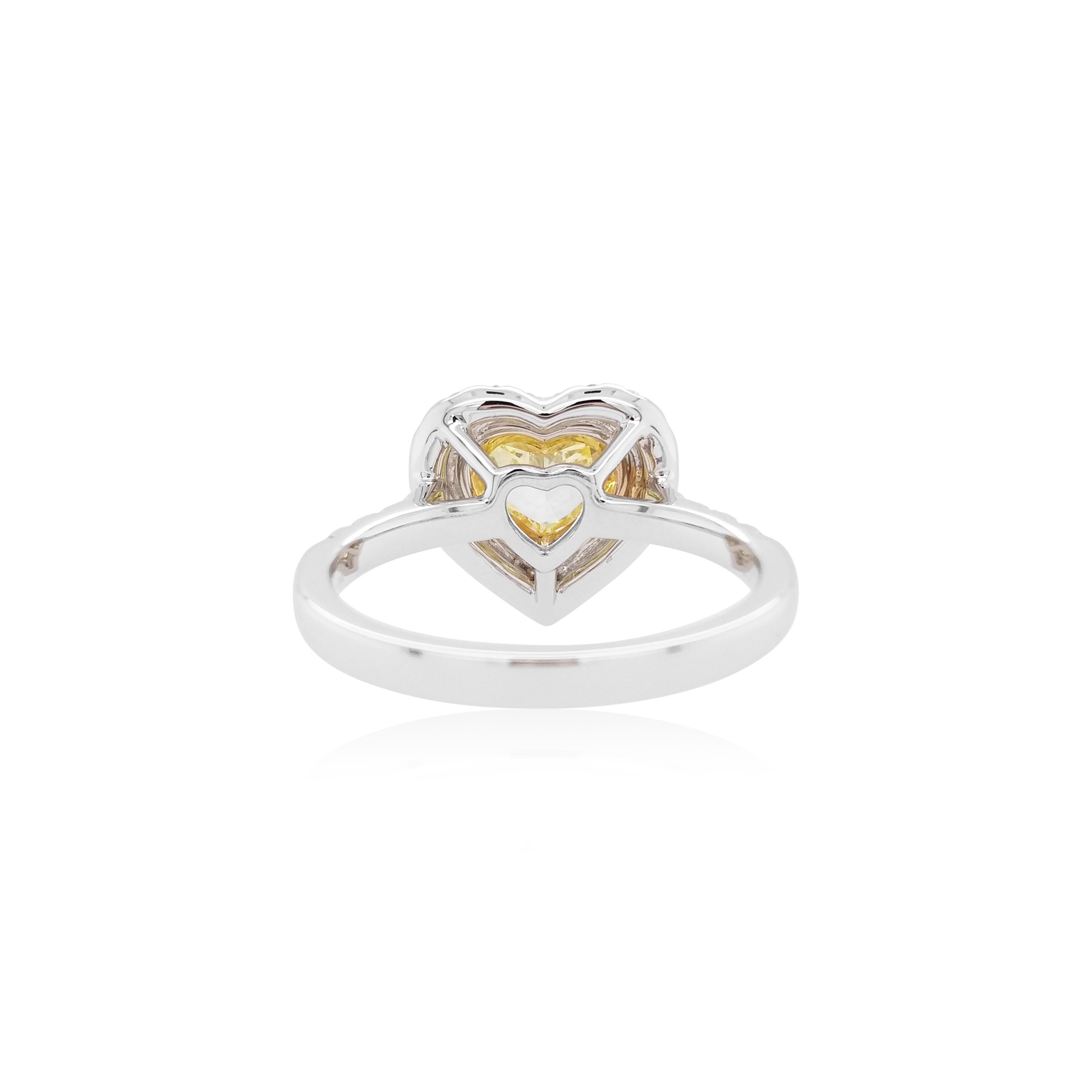 This charming Heart Shape ring has a rare GIA certified Fancy Yellow Diamond. The heart shape yellow diamond is surrounded by Yellow Melee diamonds and White diamonds, making it the perfect engagement ring for someone special.
A perfect companion to