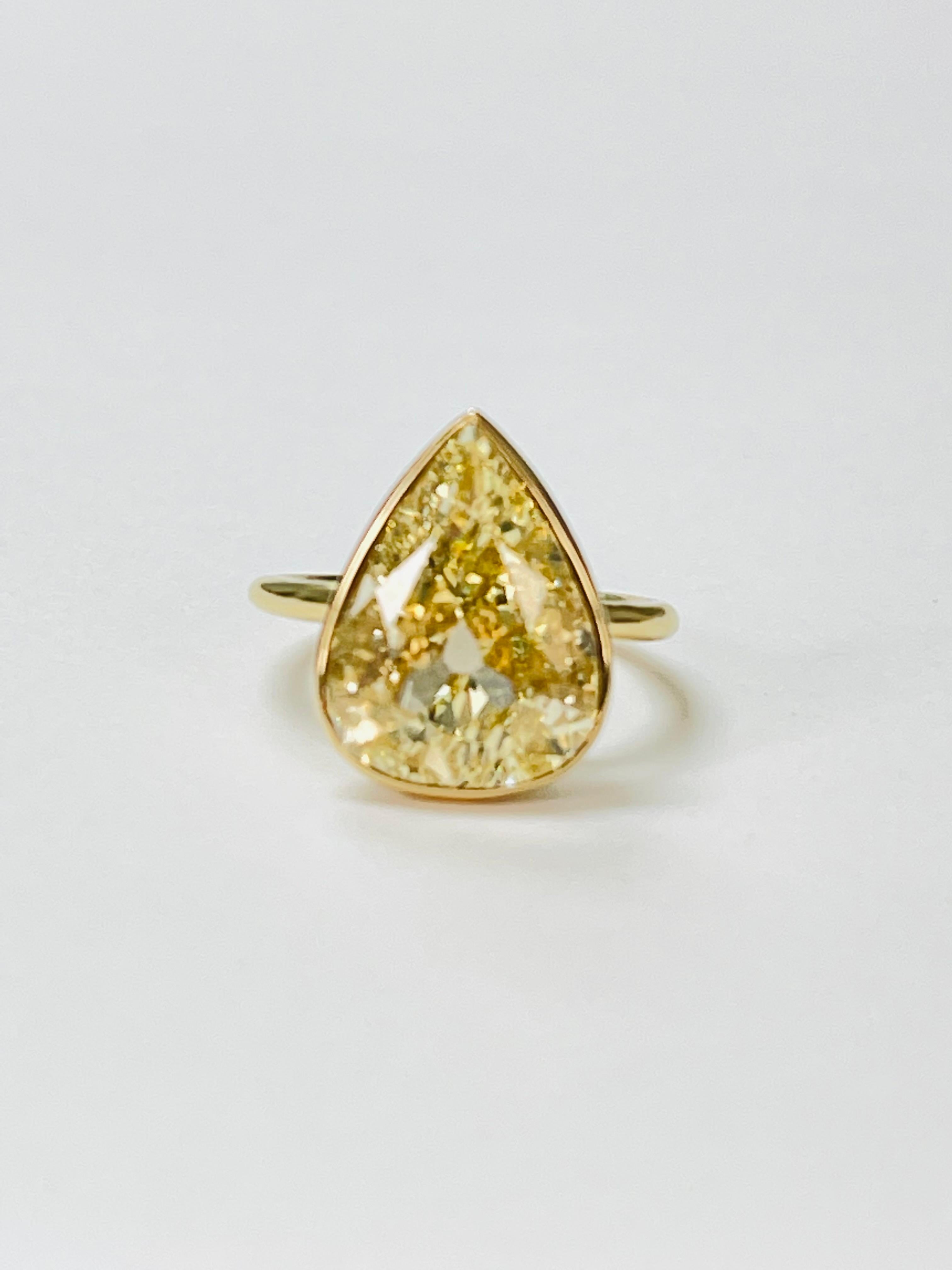Contemporary GIA Certified Fancy Yellow Pear Shape Diamond Ring in 18k Yellow Gold For Sale