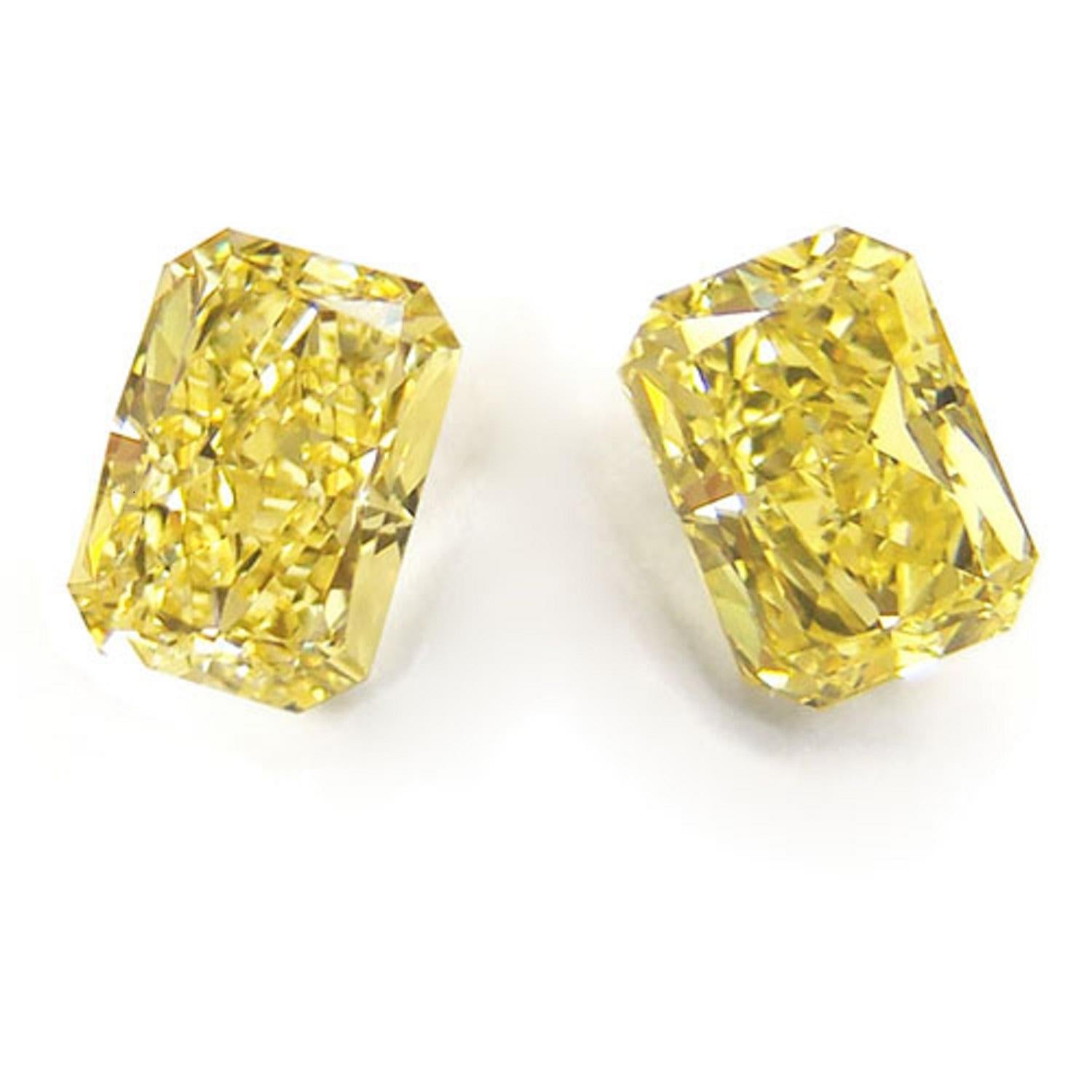 Stunning and substantial 2.58 carat pair of radiant cut diamonds is completely eye clean, displays gorgeous, cheery yellow color, and sparkles with fantastic brilliance! The diamonds are both certified by GIA, the world’s premier gemological