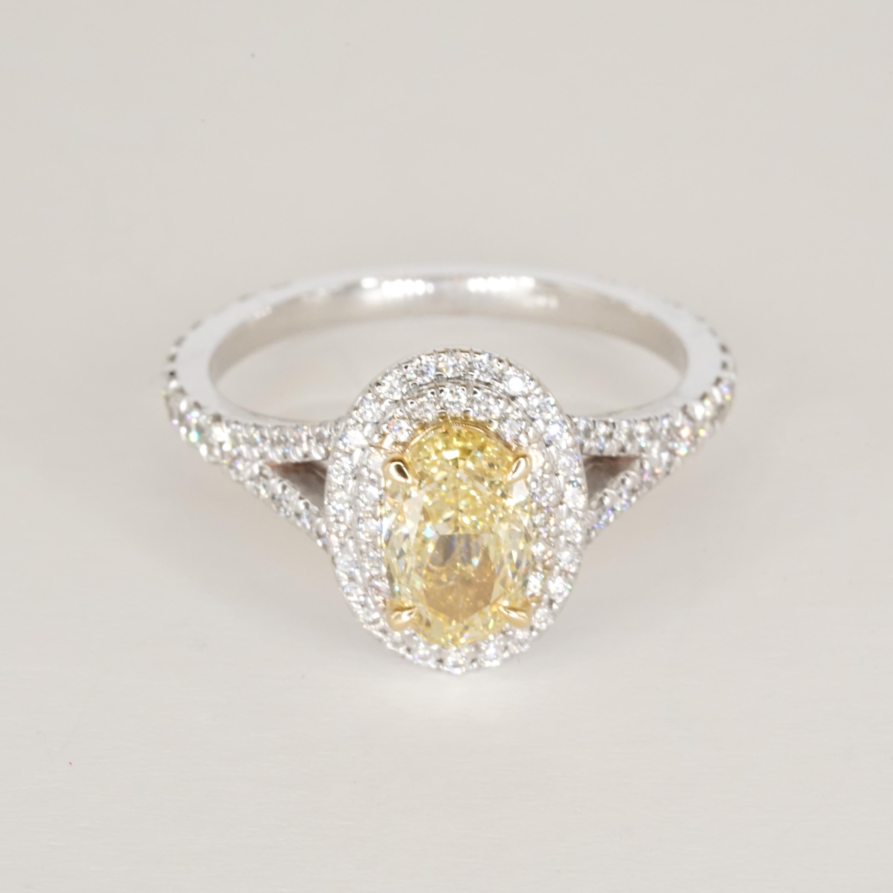 GIA Certified Fancy Yellow VVS2 Oval Diamond Double Halo Gold Ring For Sale 1