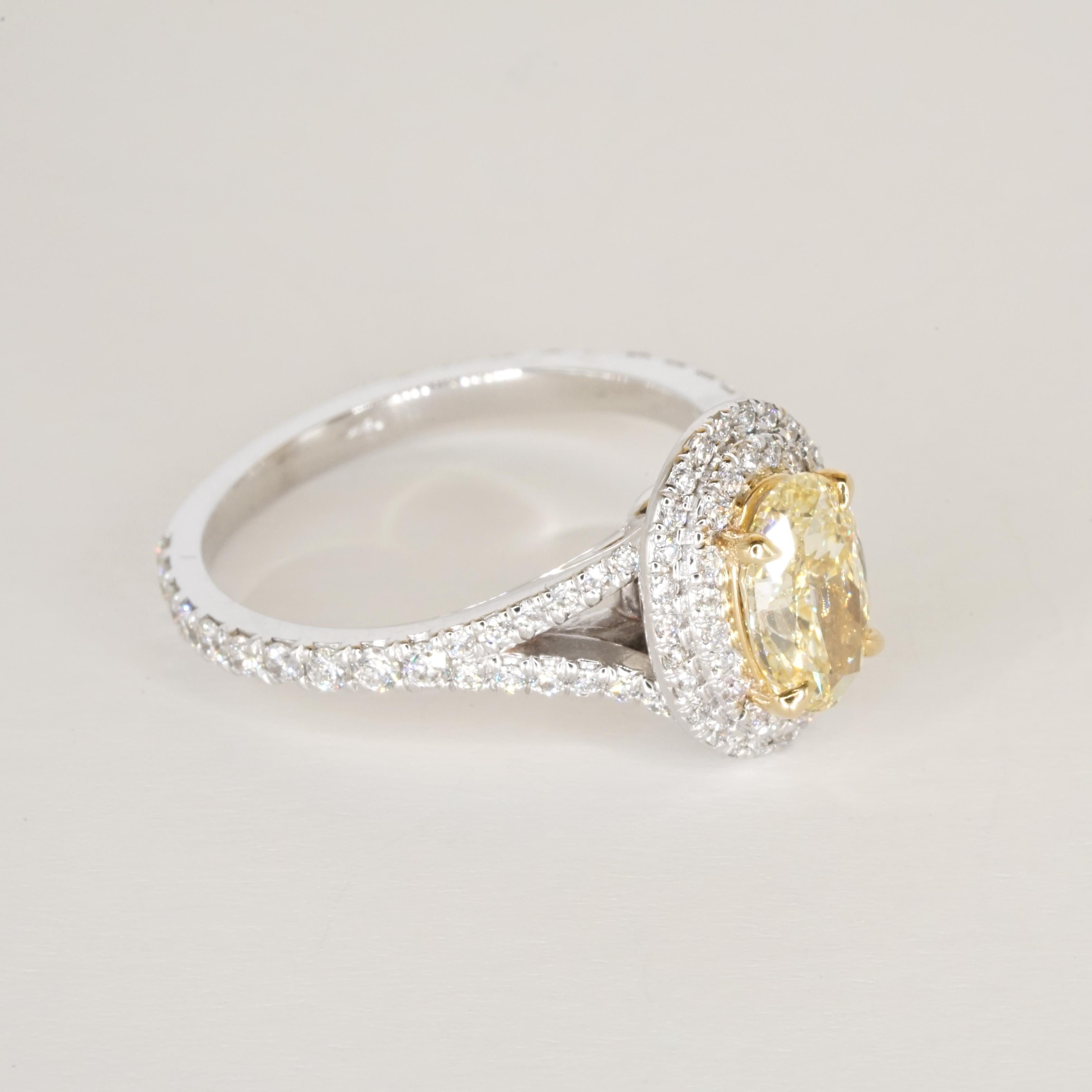 GIA Certified Fancy Yellow VVS2 Oval Diamond Double Halo Gold Ring For Sale 2