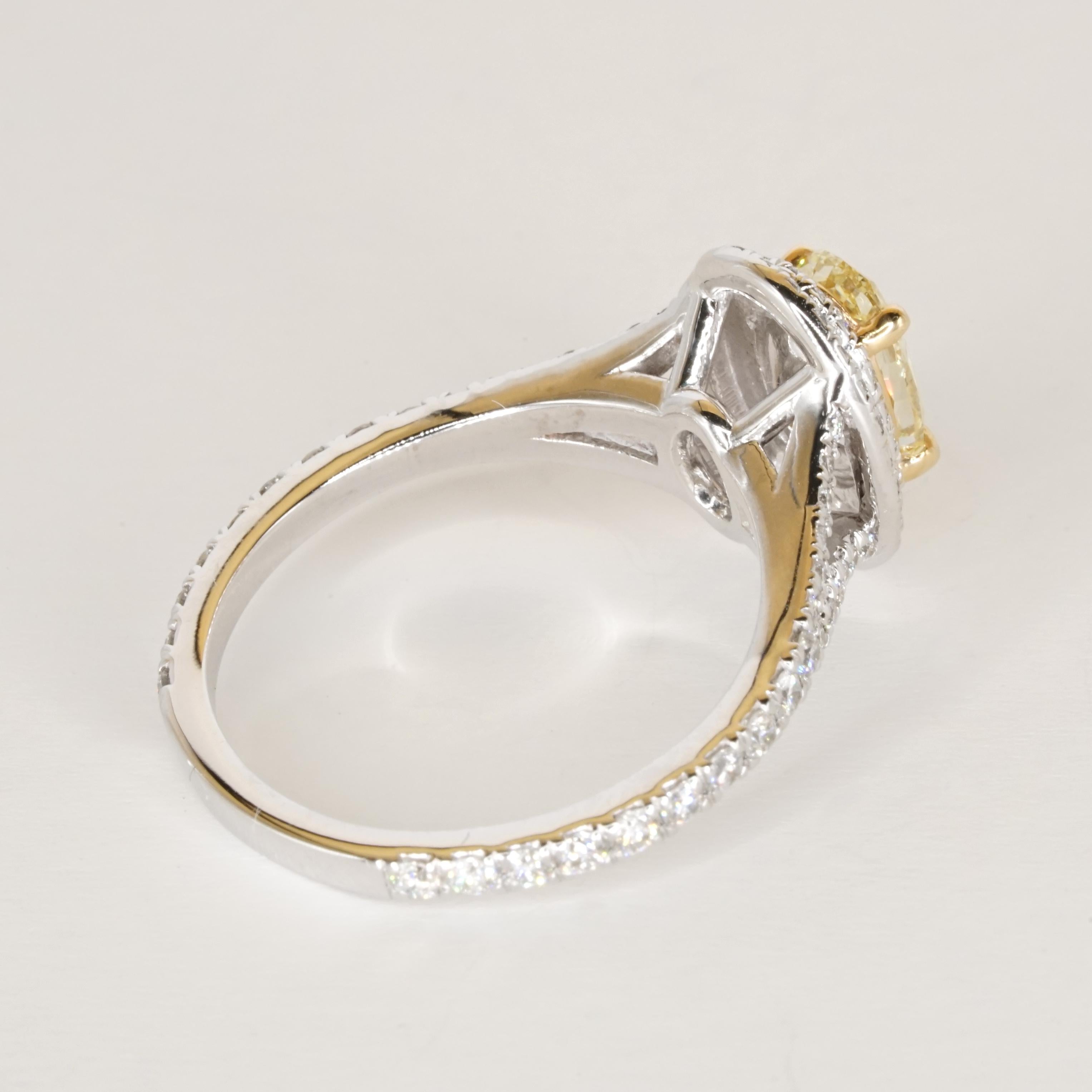 GIA Certified Fancy Yellow VVS2 Oval Diamond Double Halo Gold Ring For Sale 3