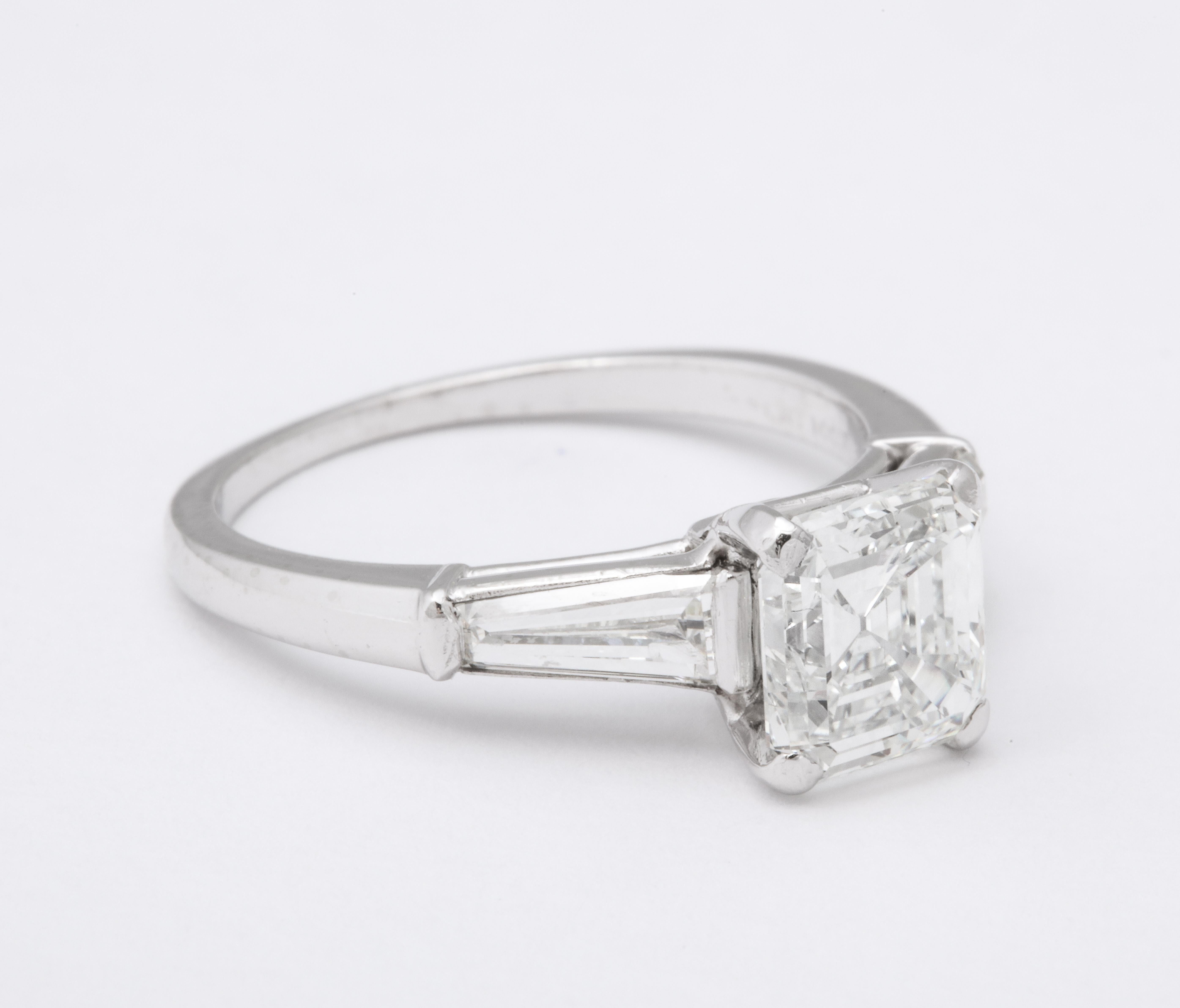1.65cts square emerald cut diamond GIA certified G VVS2 set in platinum with tapered baguette diamonds. 
The design is classic and elegant and the stone is a wonderful shape.  GIA certification is included for your piece of mind and quality