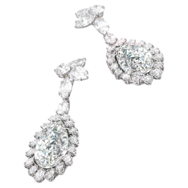 Enhance your elegance with these exquisite Golconda Pear Cut White Diamond Dangle Earrings, certified by GIA. Each earring features a stunning 2-carat pear-cut diamond, renowned for its timeless beauty and brilliance. Set in platinum, these earrings