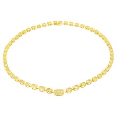 Collar tipo «tenis» con diamantes ovalados amarillos de fantasía, certificado por el GIA