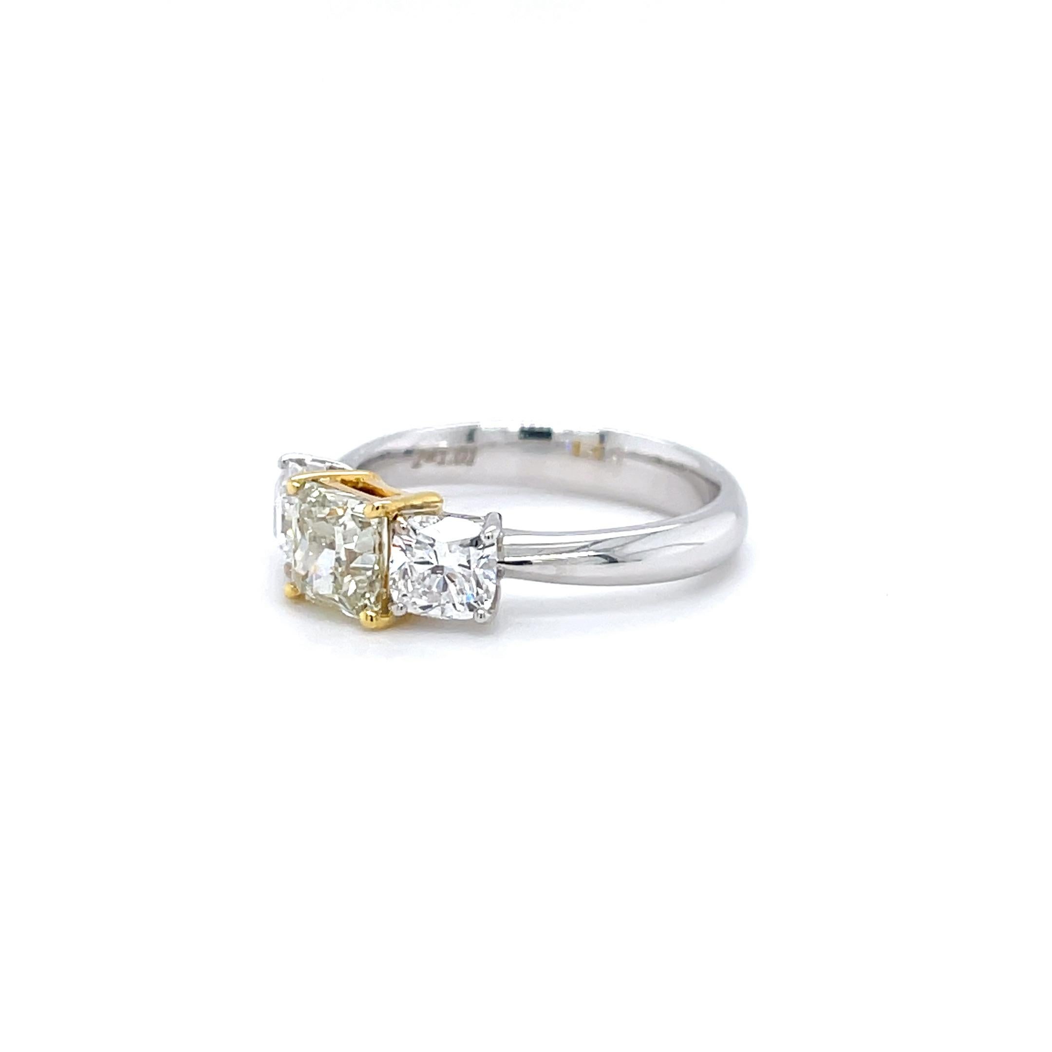 Captivating Three-Stone Ring Featuring a Rare Fancy Light Yellowish Green Diamond

This captivating three-stone ring features a truly unique center stone: a 1.00 carat square radiant cut diamond certified by the Gemological Institute of America