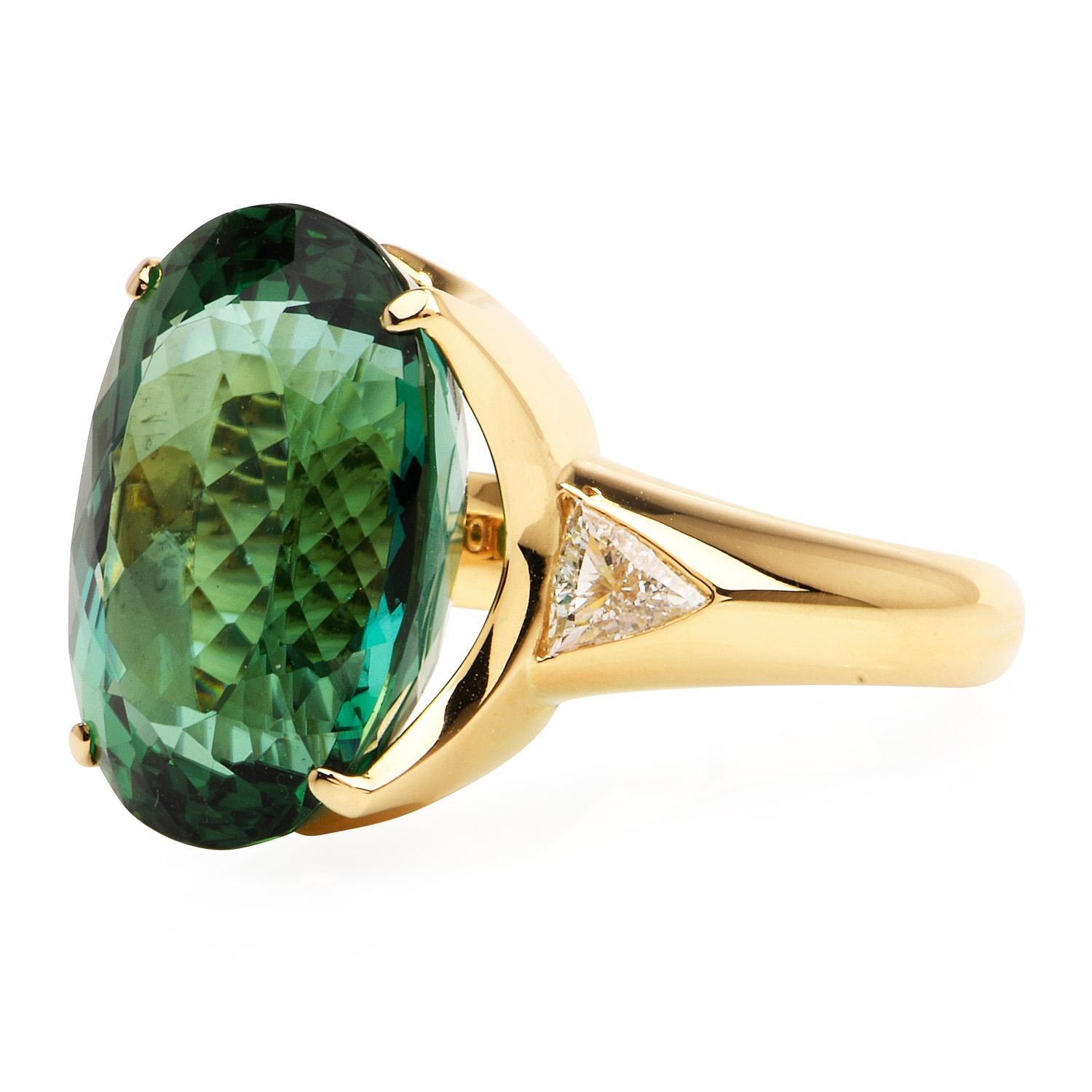 This exquisite Green Tourmaline Cocktail Ring is a splash of color with an effortless sparkle, Crafted in solid heavy 18K yellow gold, the center is adorned by a GIA certified Green Tourmaline, Oval cut, Prong-set, weighing approximately 19.42