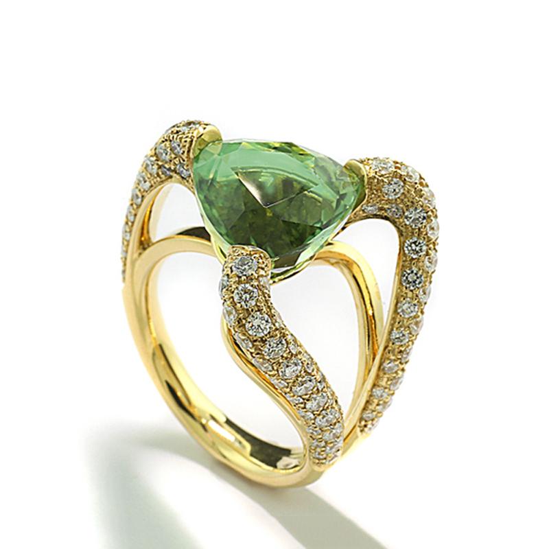 an exceptional cocktail ring with a tourmaline approx. 7.28 carat, in mint green with light turquoise tint, transparent with very good brilliance.  Shape: Tricorn in modified brilliant cut, origin: Afghanistan. With gemstone report by GIA No.