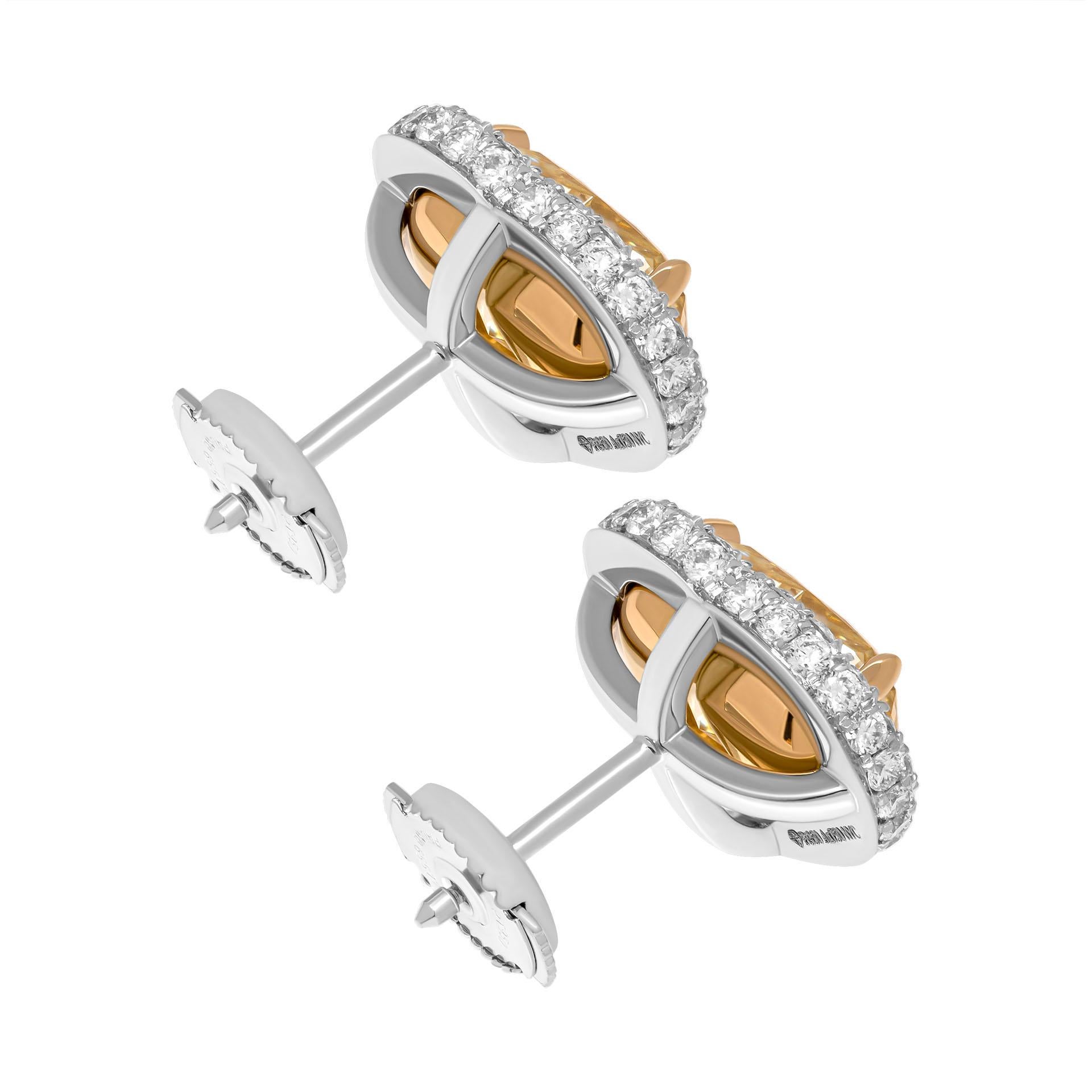 GIA Certified Double edge halo studs earrings in 18K Yellow Gold and Platinum
With 2 Fancy Yellow Heart Shape Diamonds:

2.47ct Natural Fancy Yellow VS1 Heart Shape Diamond GIA#6435264603
2.67ct Natural Fancy Yellow VS1 Heart Shape Diamond