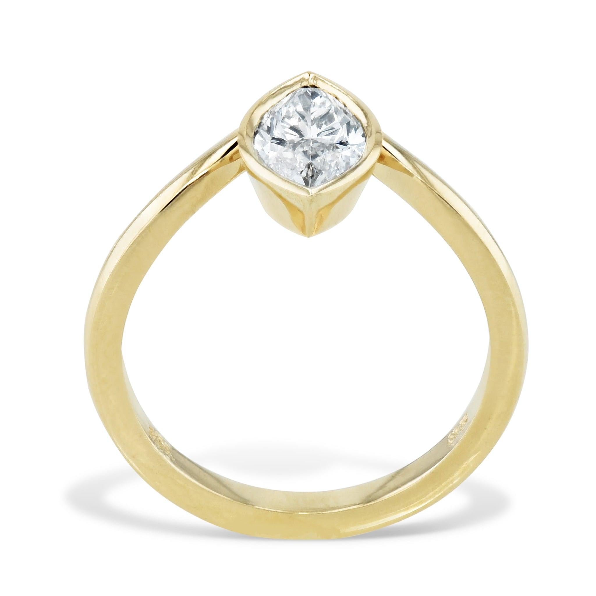 Discover the Marquise Diamond Yellow Gold Engagement Ring from the H&H Collection. 
This ring is Handcrafted with 18kt yellow gold and featuring a bezel set center diamond with GIA # 5201384236 and is one of a kind. 
This ring is currently a size