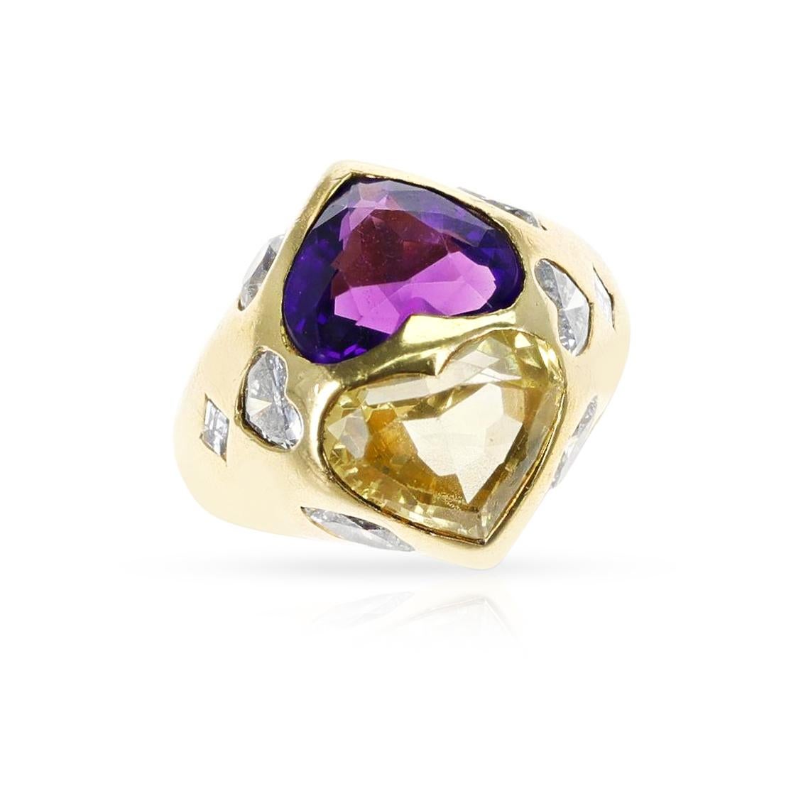 A GIA Certified Heart Shape Natural Yellow Sapphire and Amethyst Twin Ring with Diamonds. The yellow sapphire is unheated as stated by GIA and weighs appx. 4.75 carats. The ring is made in 18k Yellow Gold. The total weight of the ring is 18.40