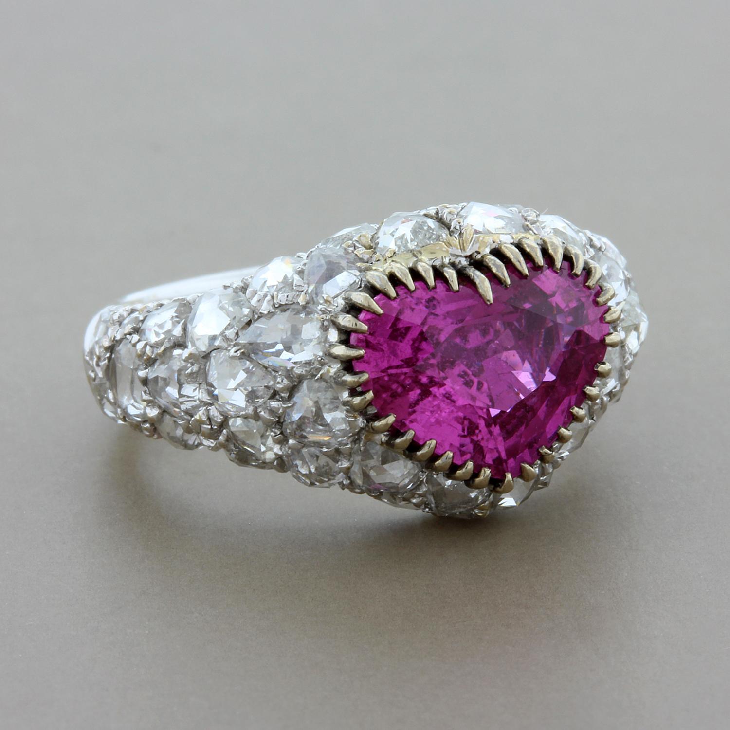 A lovely one of a kind ring featuring a beautifully colored GIA certified pink sapphire, about 2.82 carats heart shaped. Accenting the center gemstone and covering the ring are 2.42 carats of rose cut diamonds set in 18K white gold. 

GIA