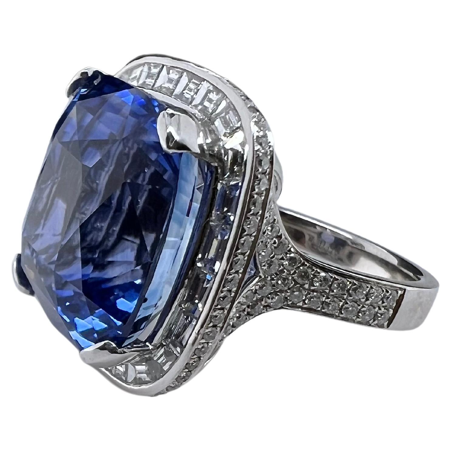 This phenomenal blue sapphire ring is an amazing piece for anyone's jewelry collection! The cutting on the vibrant blue sapphire is immaculate and sparkles in every angle. This heated sapphire comes accompanied with a GIA appraisal. The custom made