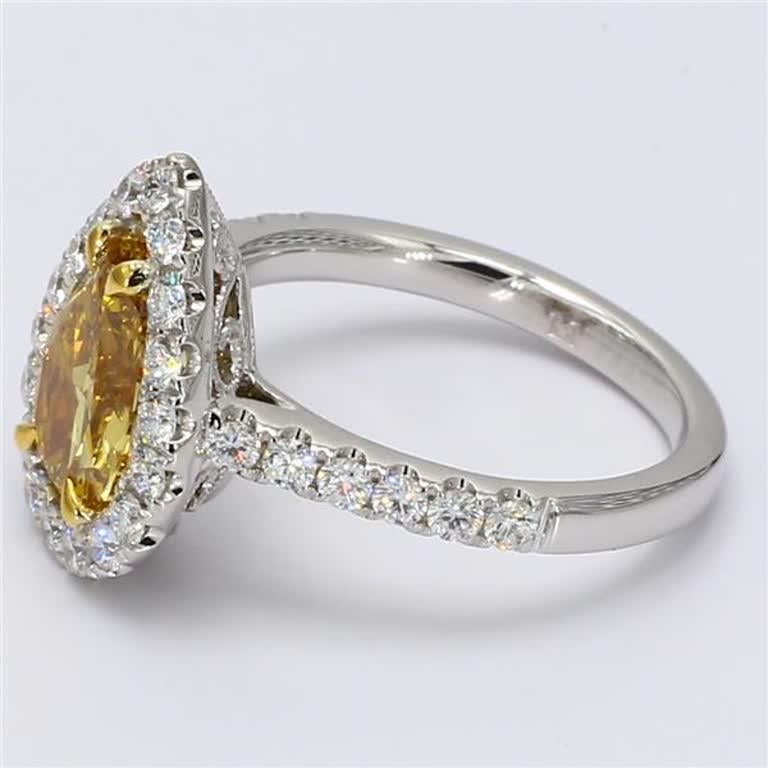 GIA certified rare pear-shape orange and white diamond ring. This ring is designed to be placed in a simple setting with a orange pear-shape surrounded by a single array of white rounds. Can be used as an engagement ring or in addition to your