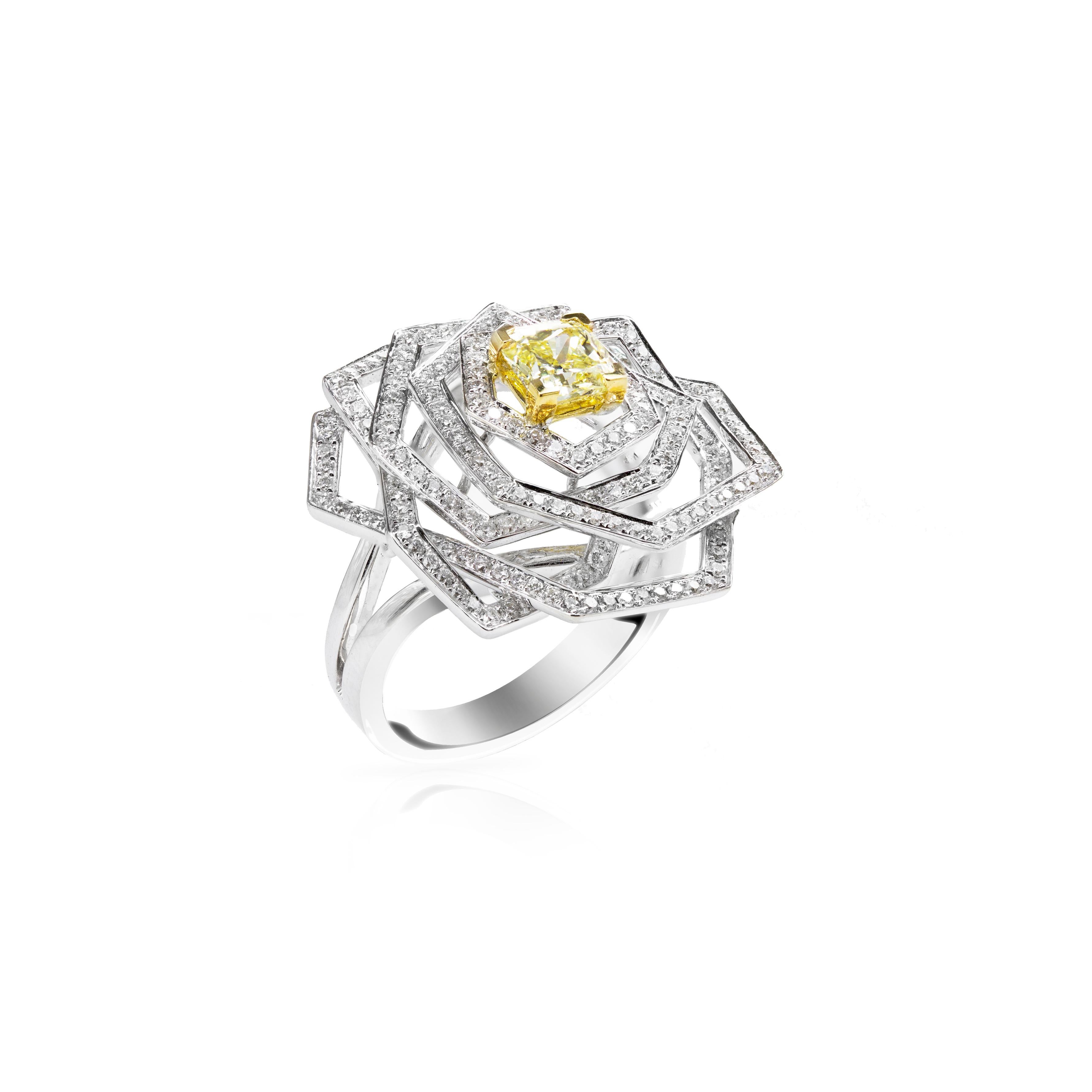 A unique and chic ring showcasing a cluster of geometric shapes encrusted with brilliant diamonds made to a rose flower design. Center is a 0.81 carats yellow diamond certified by GIA as Fancy intense yellow color and VS2 in clarity set in four