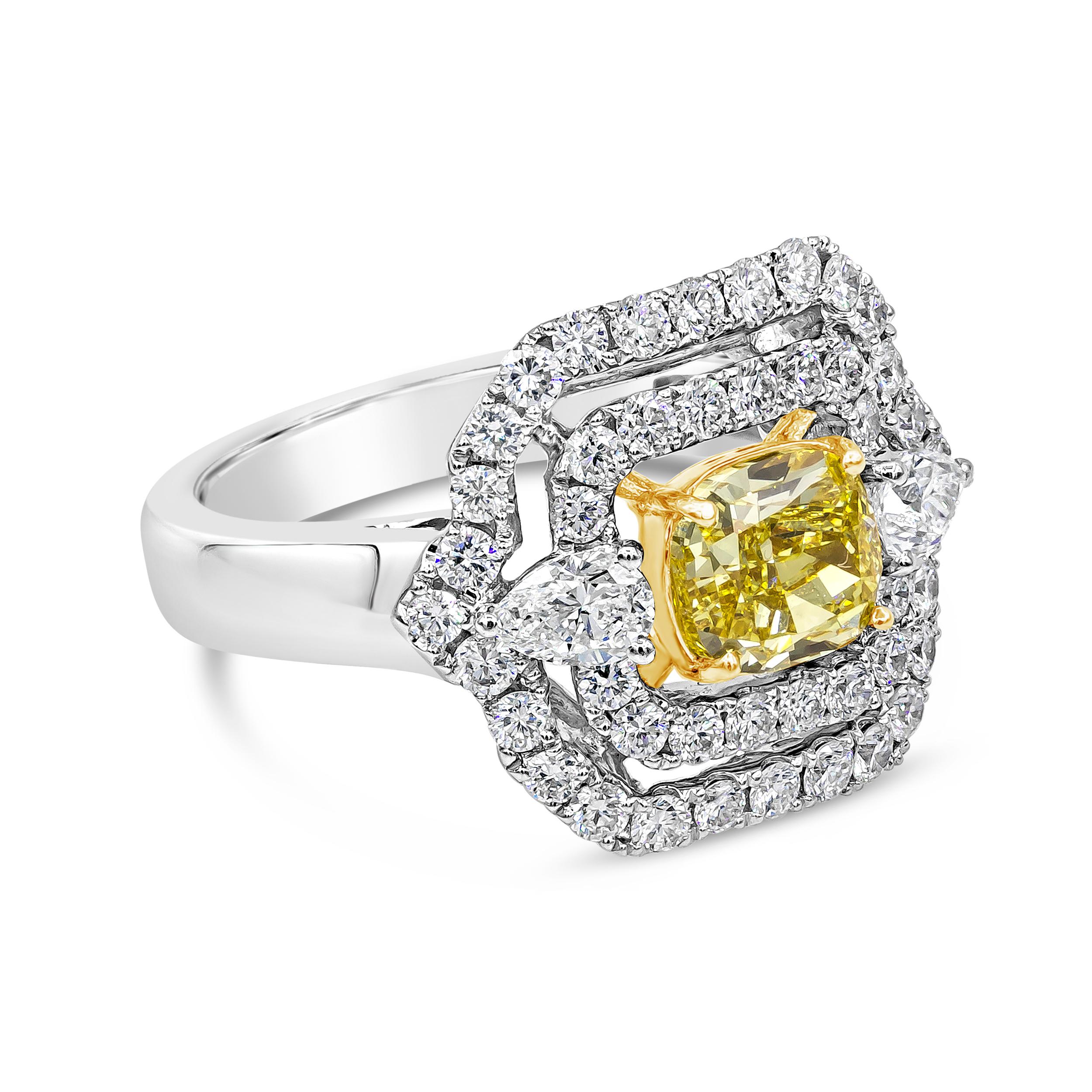 This elegant engagement ring showcasing a 1.32 carats cushion cut yellow diamond certified by GIA as Fancy Intense Yellow Color, VS1 in clarity. Center diamond is set in a floating double halo embellished with round brilliant diamonds. Finished with